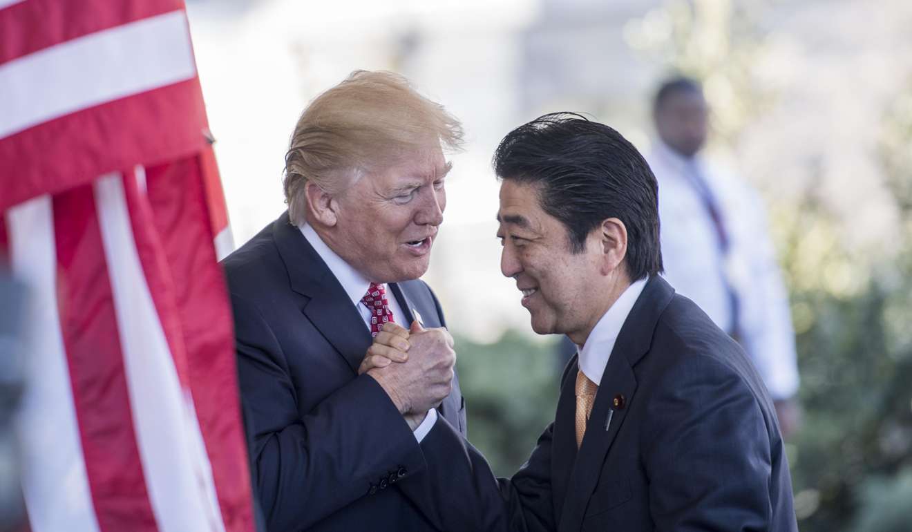 Japanese Prime Minister Shinzō Abe is greeted by President Donald Trump as he arrives at the White House in Washington, D.C. Must credit: Washington Post photo by Melina Mara