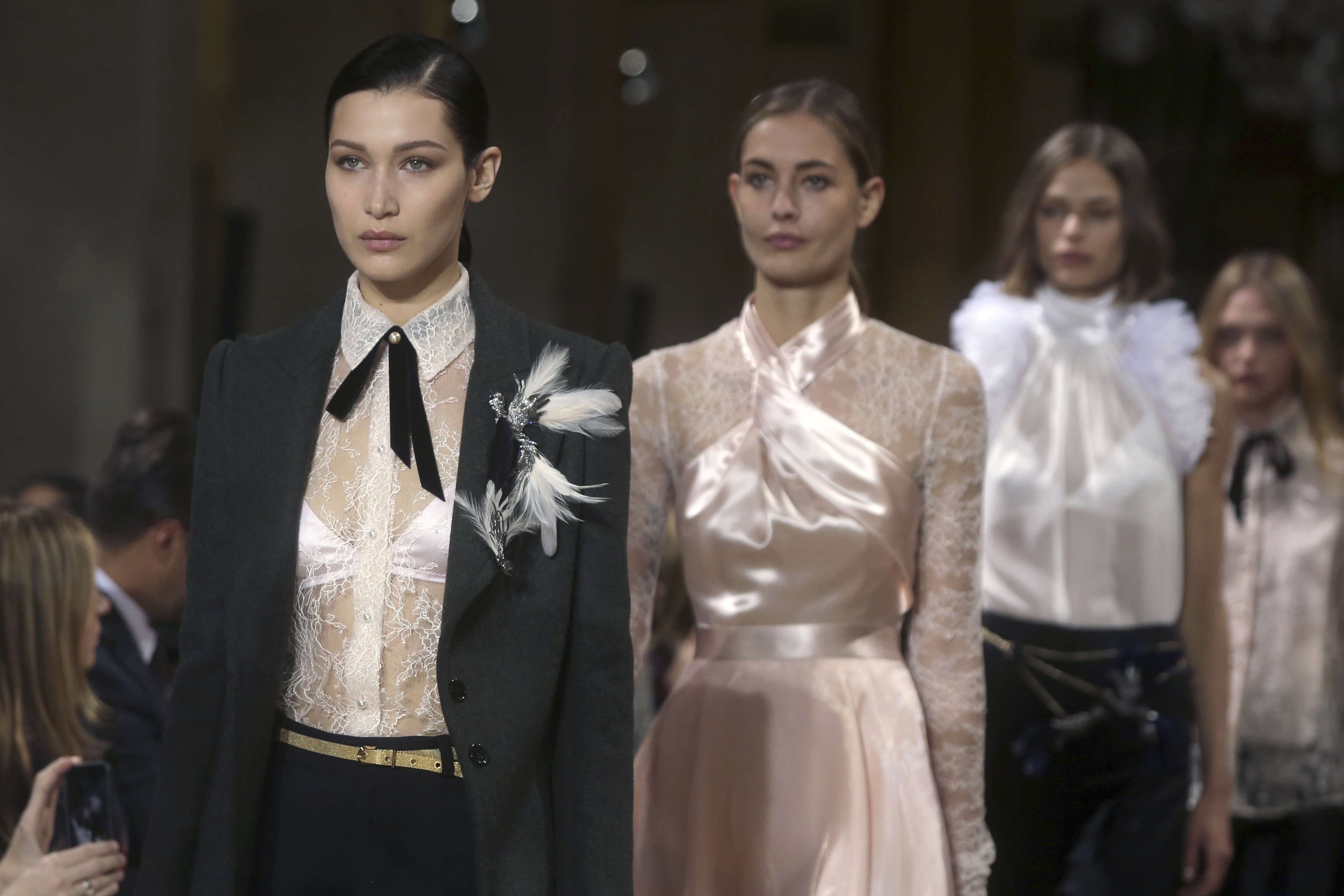 Bella Hadid, left, walks for Lanvin's autumn-winter 2017 collection at Paris Fashion Week. Photo: AP
