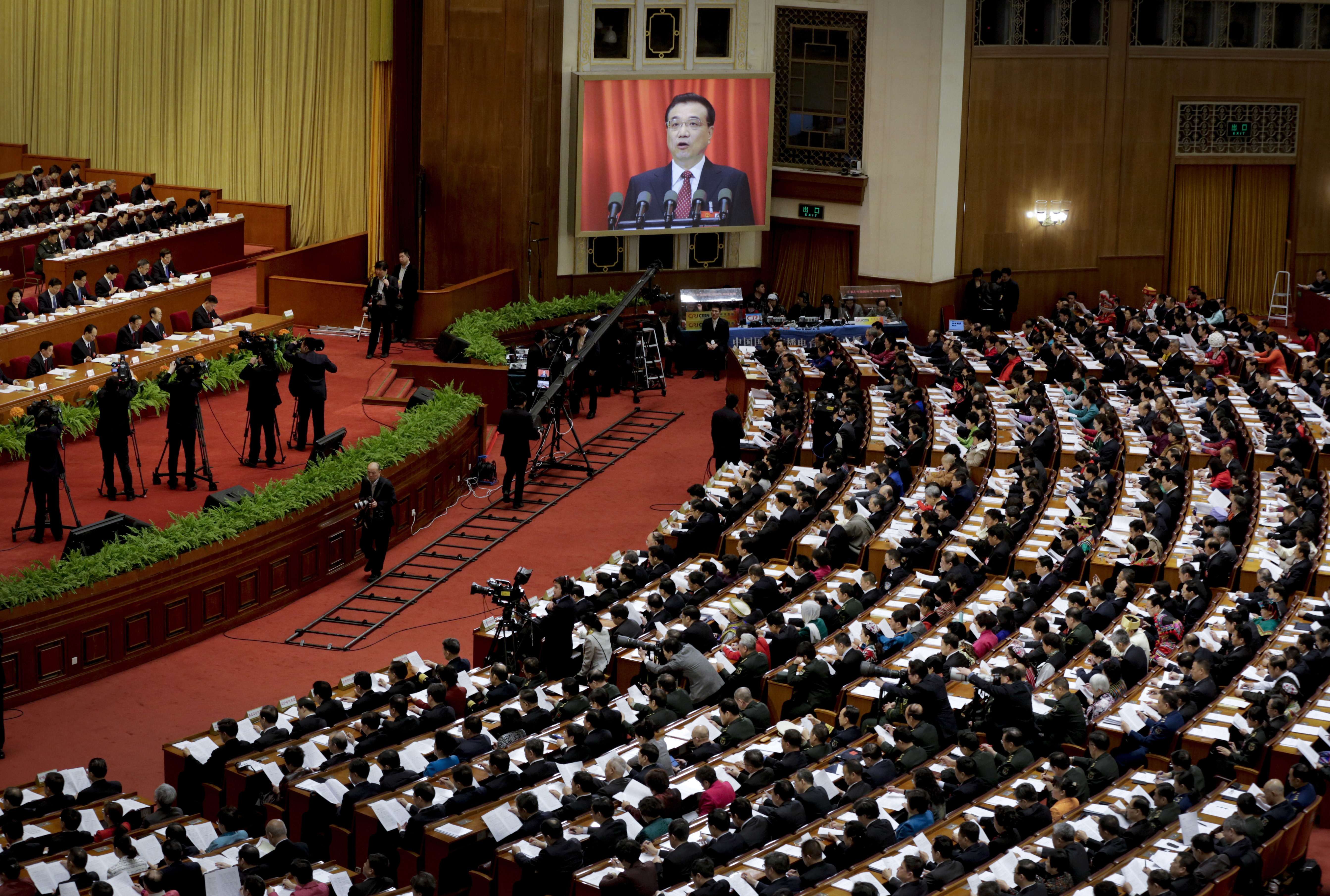 Chinese Premier Li Keqiang delivers his work report last year via video screen to the National People's Congress in Beijing. Photo: AP