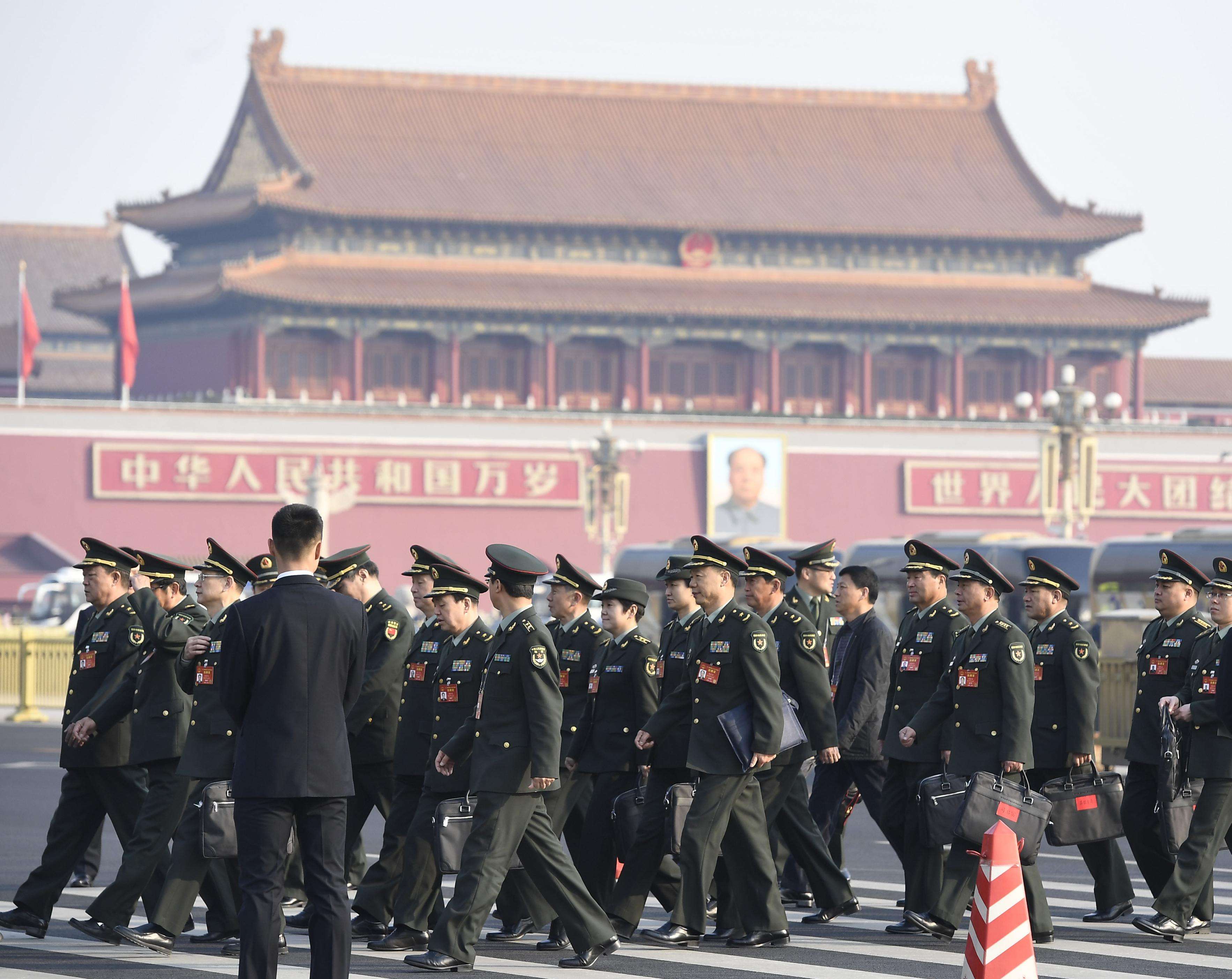 Senior officials of the People's Liberation Army walk to the Great Hall of the People in Tiananmen Square in Beijing on Saturday. Photo: Kyodo