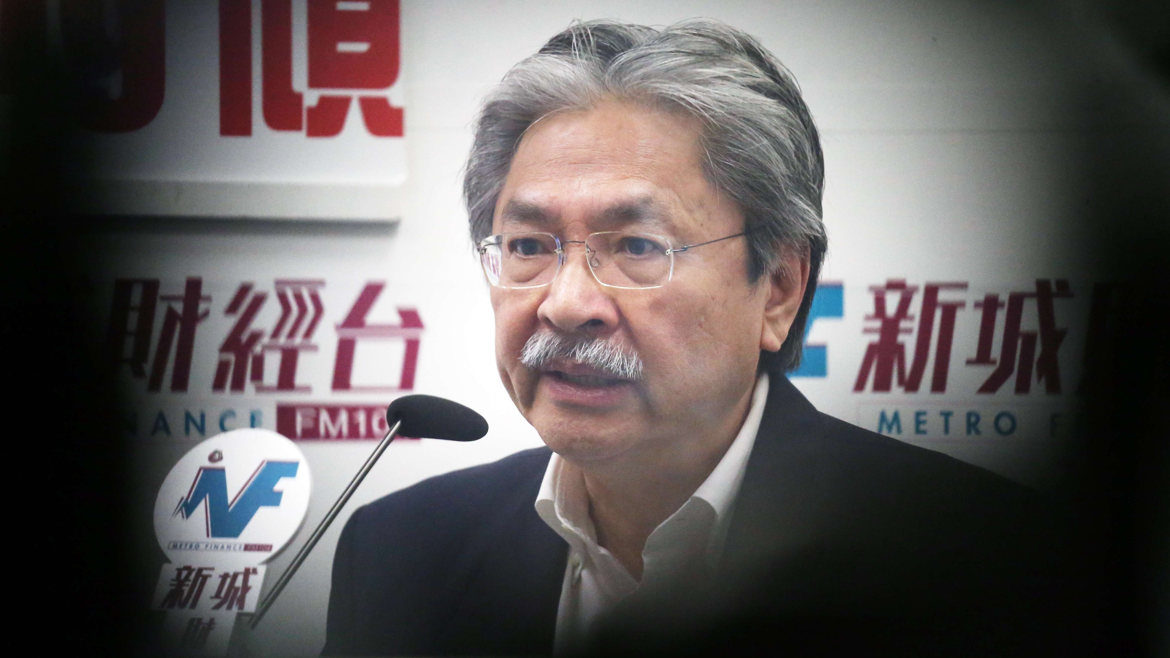 Chief executive candidate and former financial secretary John Tsang Chun-wah speaks on radio on Tuesday. Photo: K. Y. Cheng