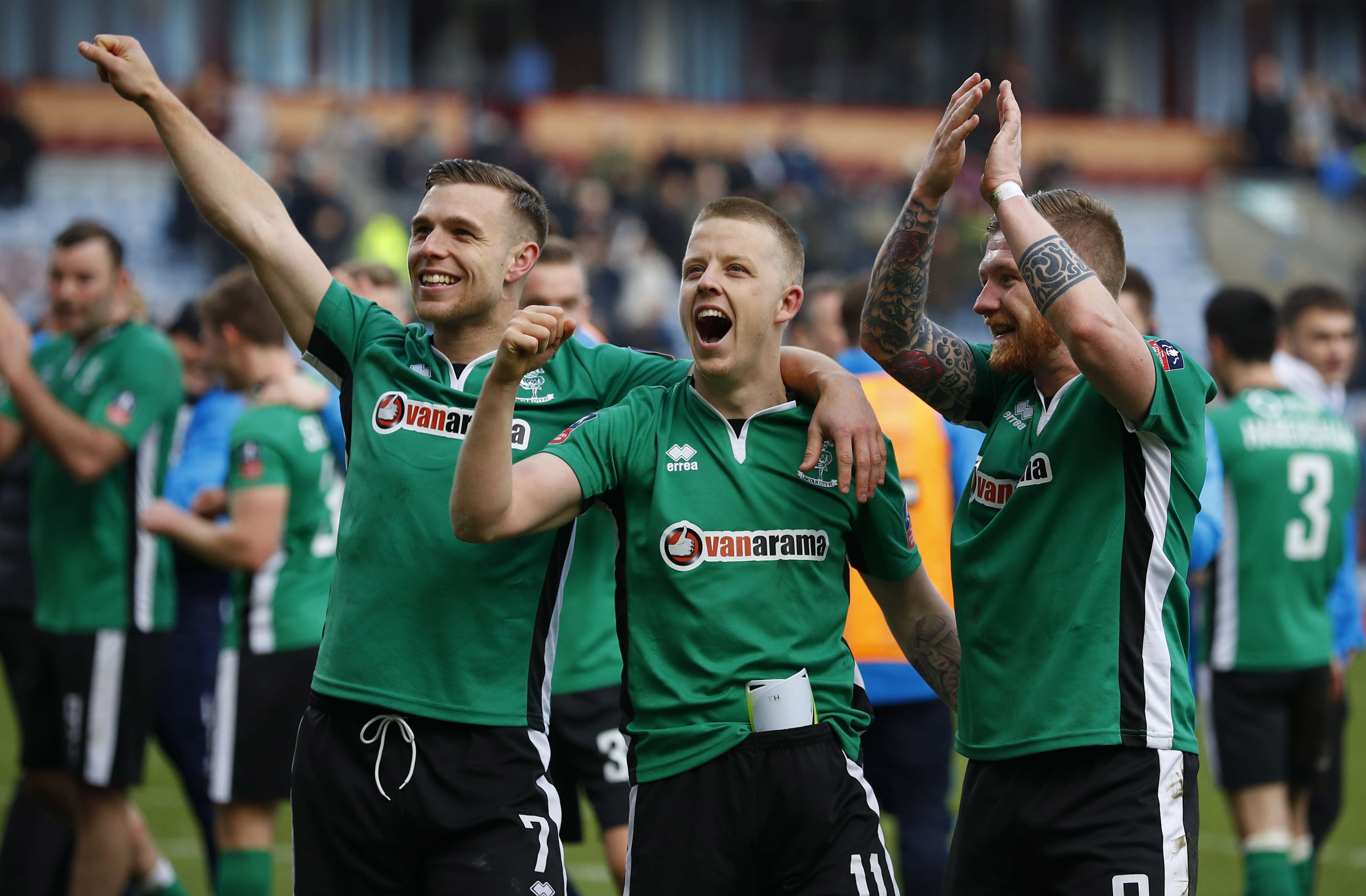 Lincoln's Alan Power, Terry Hawkridge and Jonathan Jack Muldoon celebrate their win over Burnley. Photo: Reuters