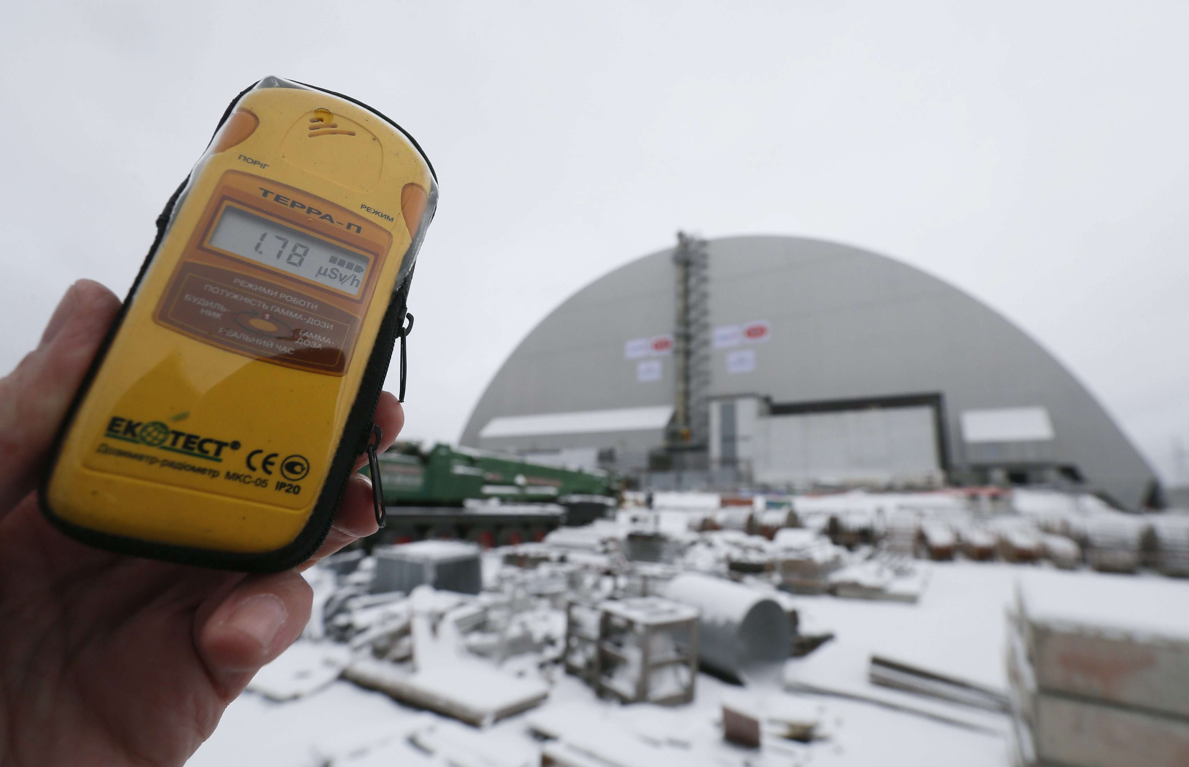 A dosimeter shows the radiation level near a new protective shelter placed over the remains of nuclear reactor Unit 4, at the Chernobyl nuclear power plant in Ukraine, on November 29. The explosion of Unit 4 in the early hours of April 26, 1986, is still regarded as the biggest accident in the history of nuclear power generation. Photo: EPA