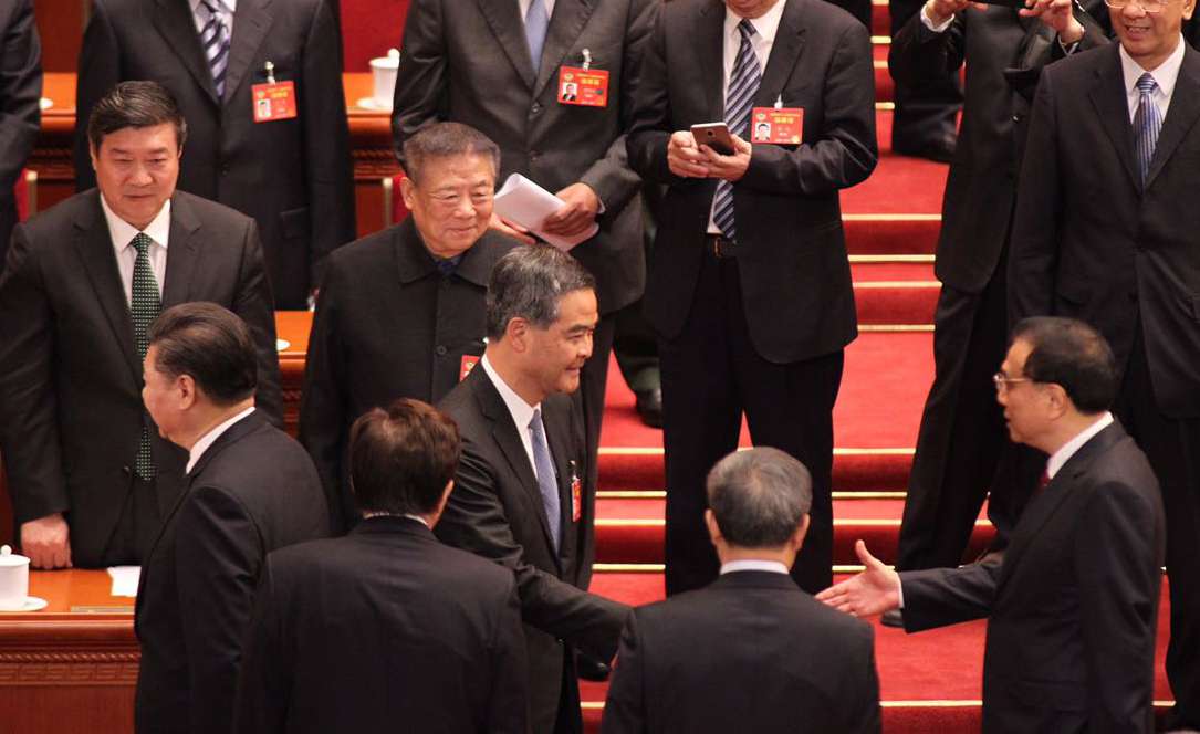 Chief Executive Leung Chun-ying (centre) shakes hands with Premier Li Keqiang. Photo: Simon Song