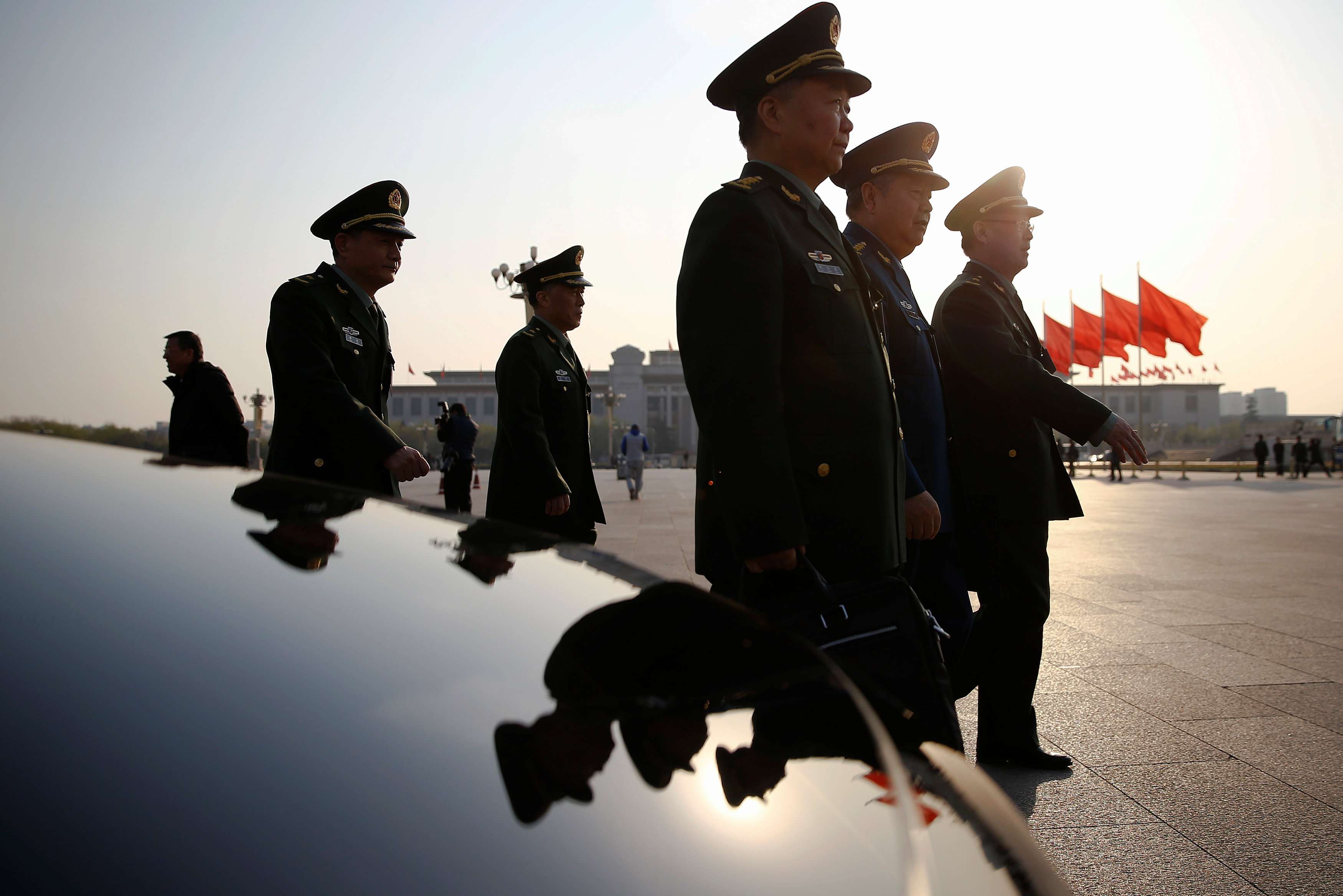 Military delegates arrive for the closing ceremony of the China's National People's Congress at the Great Hall of the People in Beijing on Wednesday. Photo: Reuters