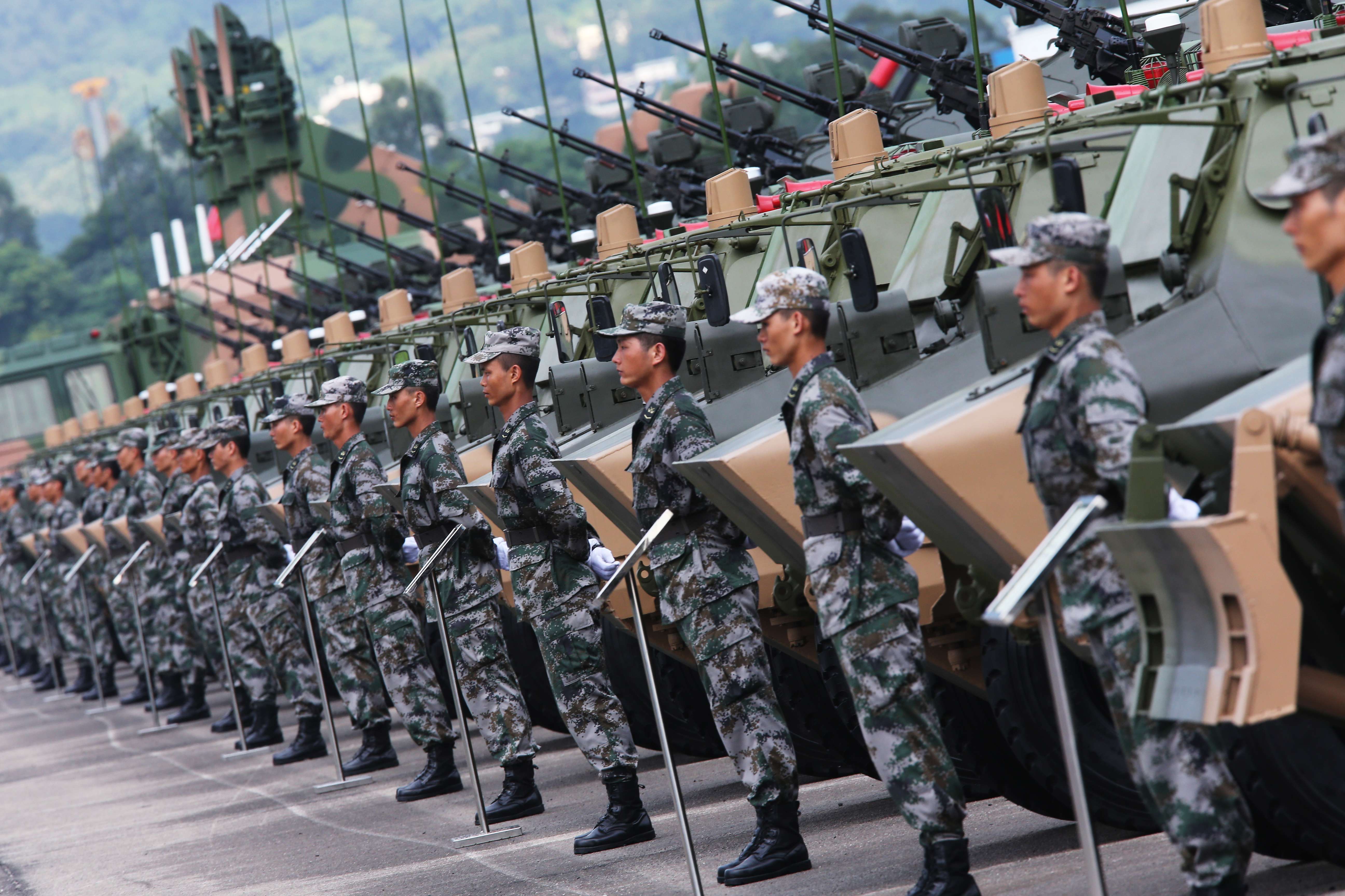 Soldiers from the People's Liberation Army Hong Kong garrison march during a military parade. The garrison is restricted from interfering in local affairs. Photo: Sam Tsang