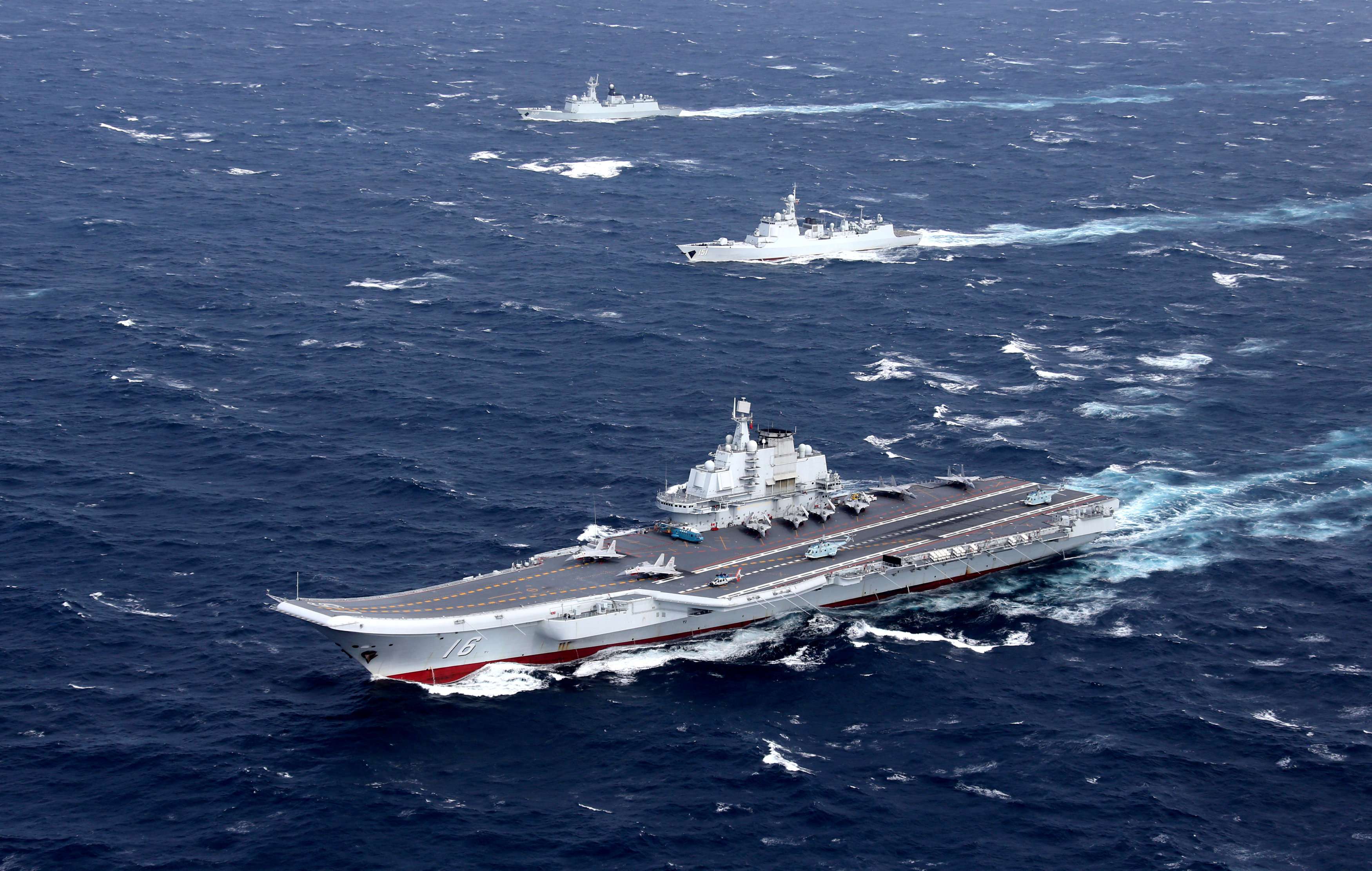 FChina's Liaoning aircraft carrier with accompanying fleet conducts a drill in the South China Sea. Photo: Reuters