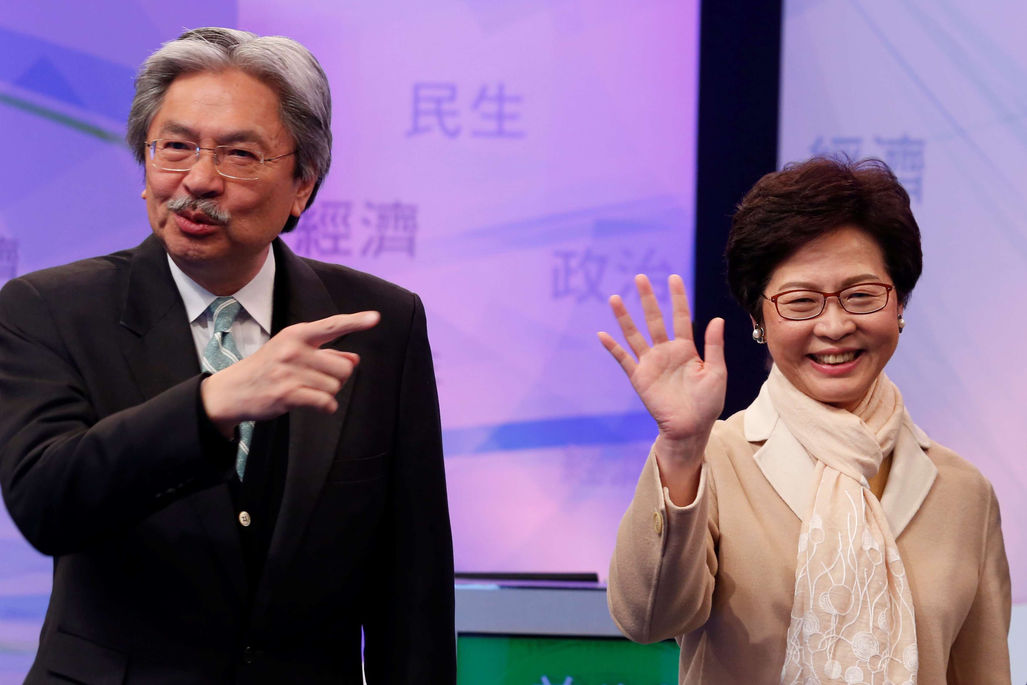 Chief executive candidates John Tsang and Carrie Lam attend an election debate on Tuesday. Beijing has made known its preferences through various channels from an early stage – no to Tsang, the former financial secretary who is leading in the opinion polls, but full support for former chief secretary Lam, the likely winner. Photo: Reuters