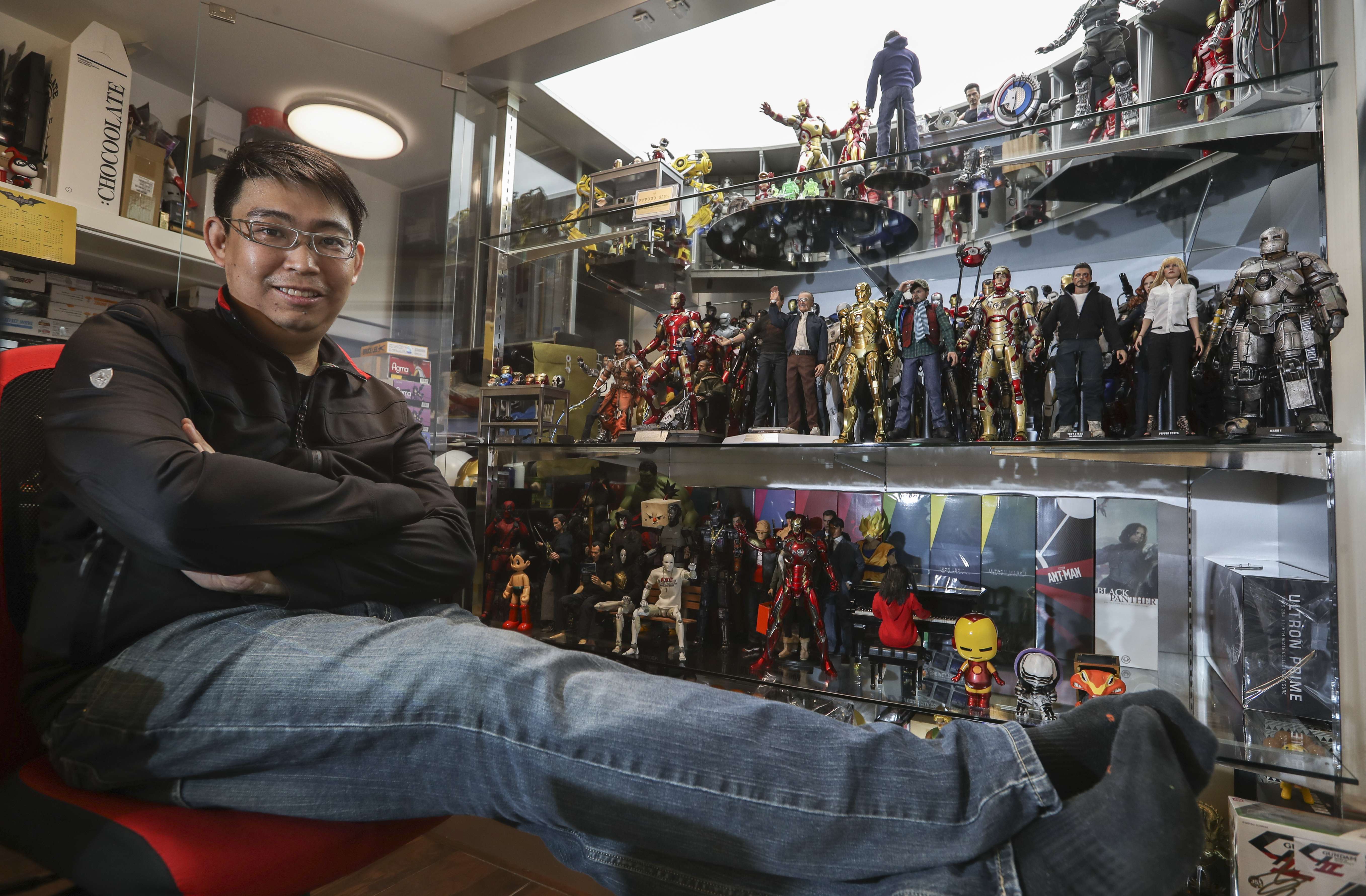 Mars Tsoi is at ease with his collection of figurines at his home in Tsuen Wan. Photo: Nora Tam