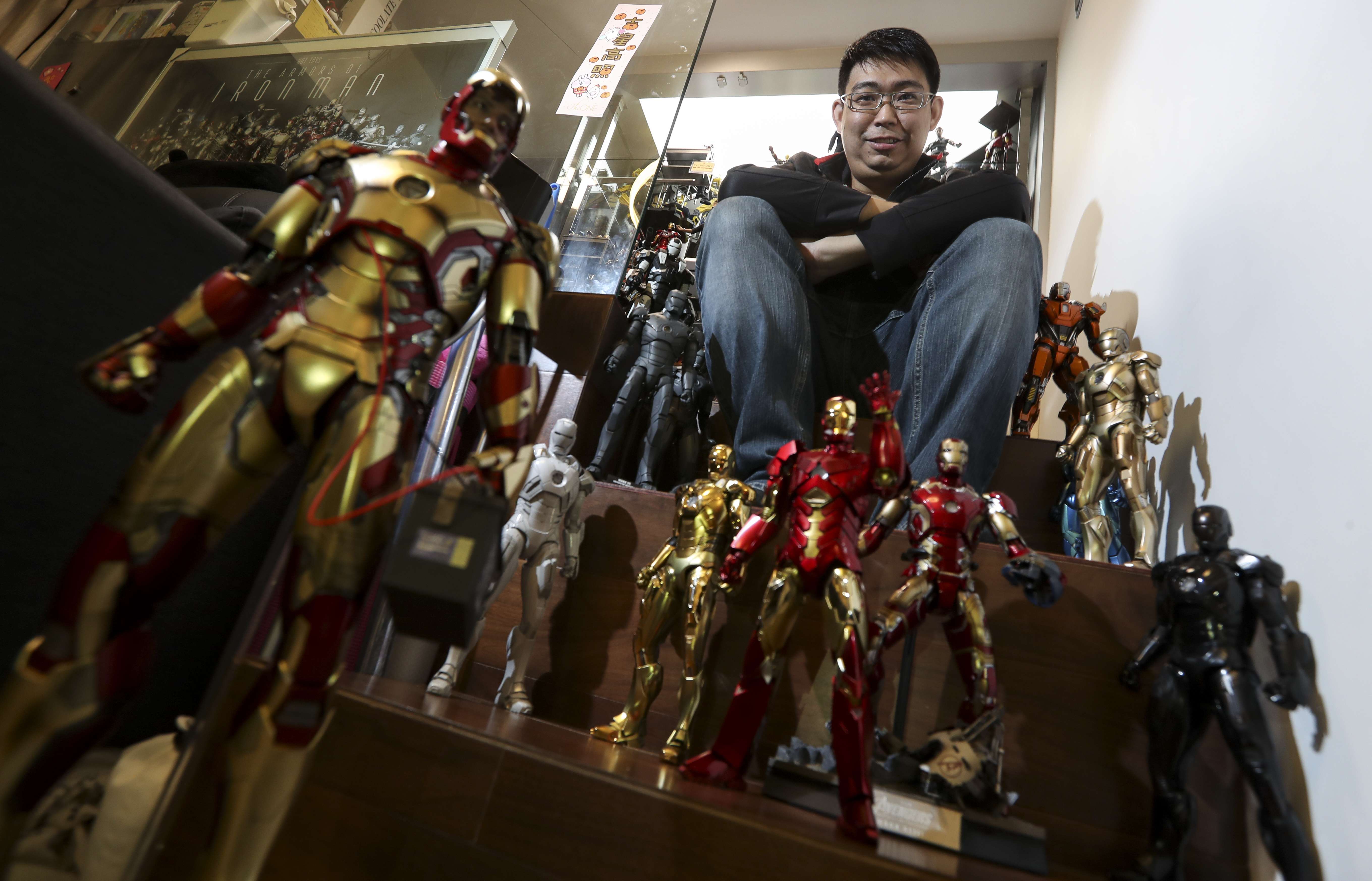 Mars Tsoi shows off his extensive collection of toy figures at his home in Tsuen Wan. Photo: Nora Tam