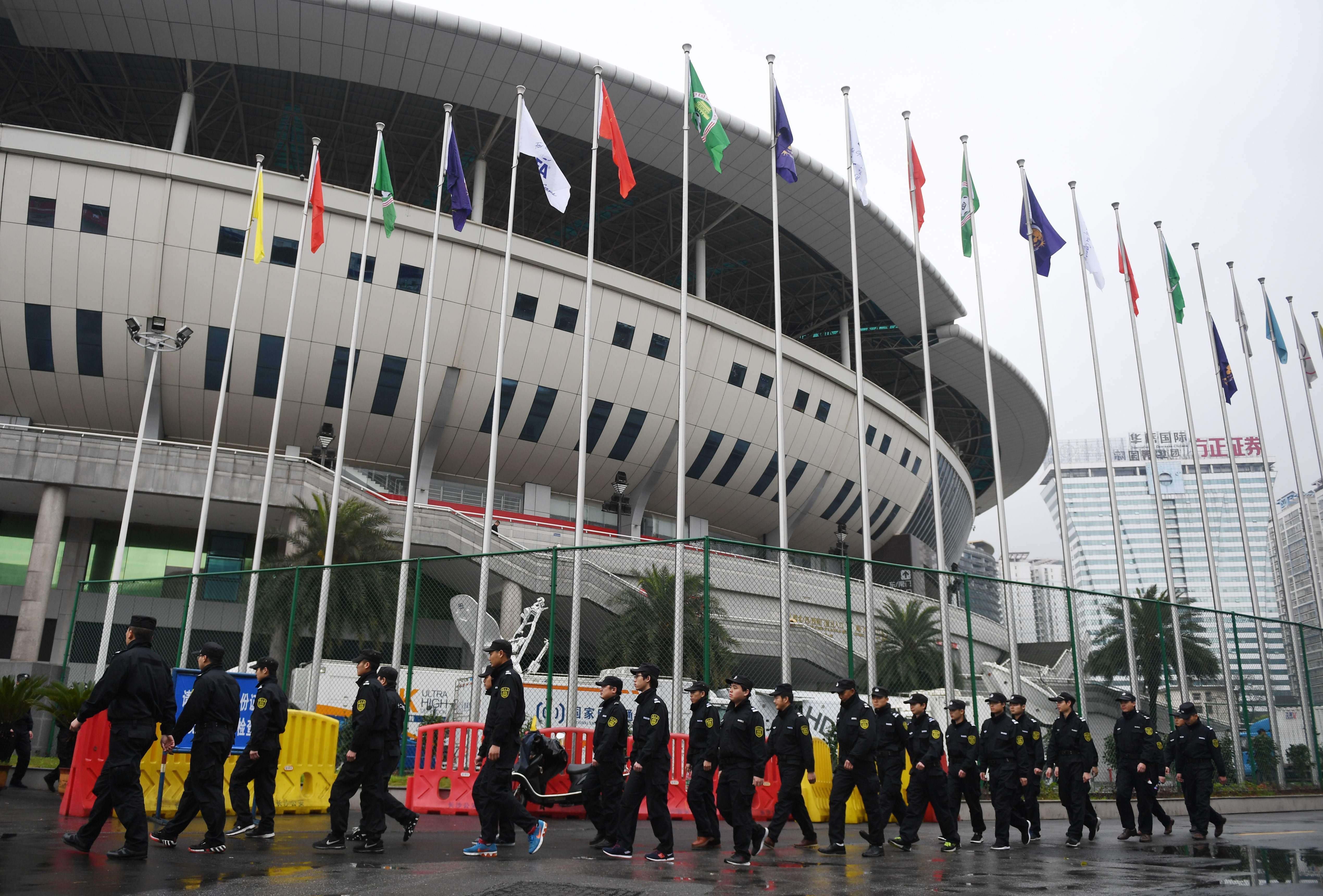Security guards outside He Long Stadium. Photo: AFP