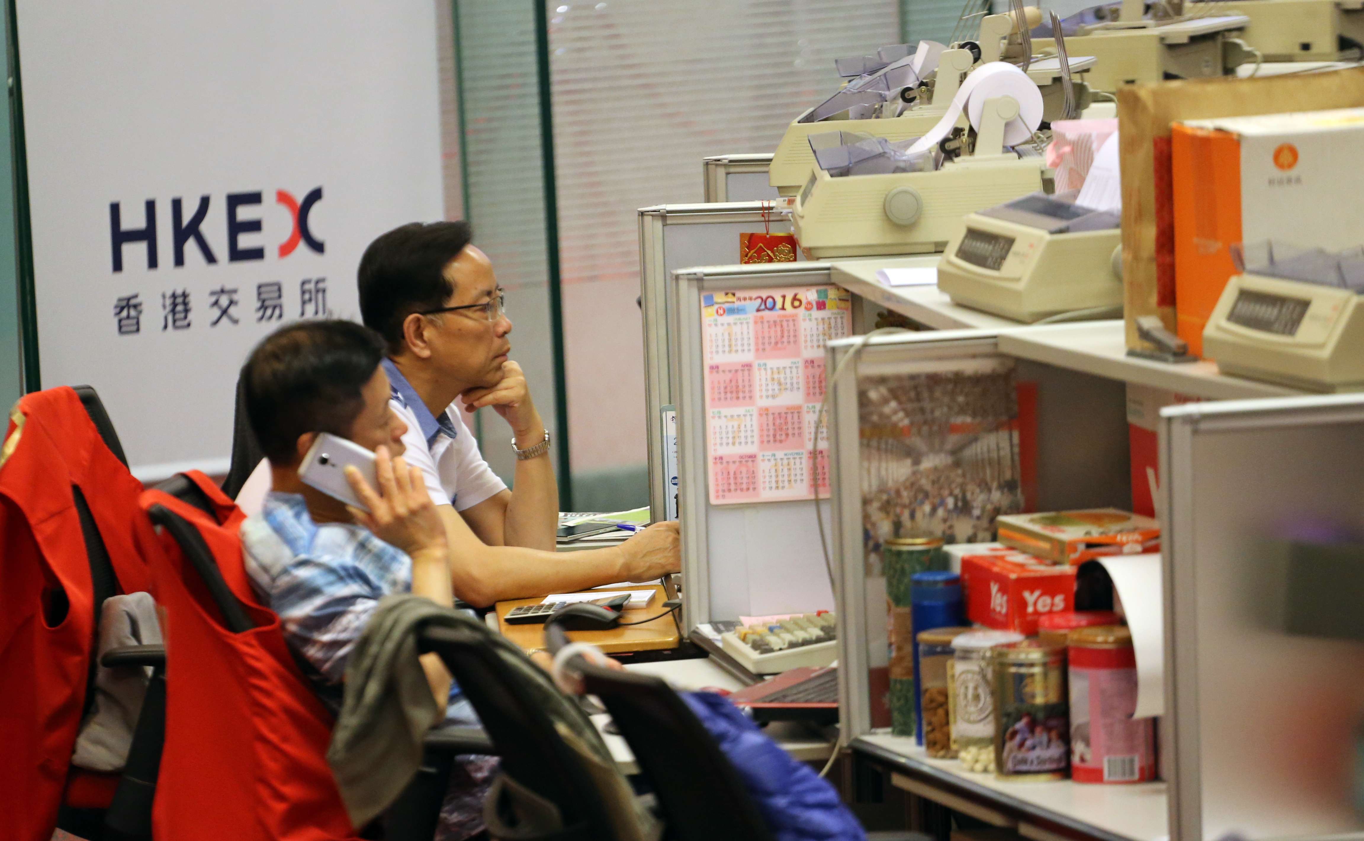 The Hang Seng Index in Hong Kong closed virtually flat at 24,327.7. Photo: Felix Wong