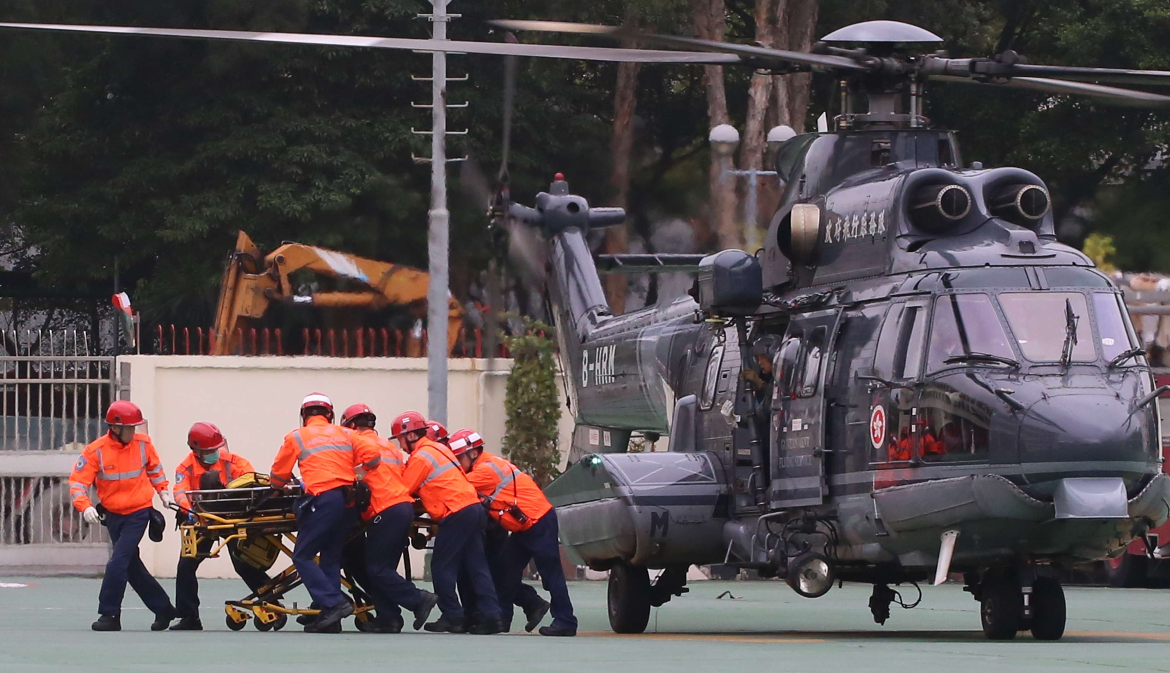 Principal fireman Yau Siu-ming is rushed to Prince of Wales Hospital after being airlifted to a Sha Tin fire station. Photo: Handout