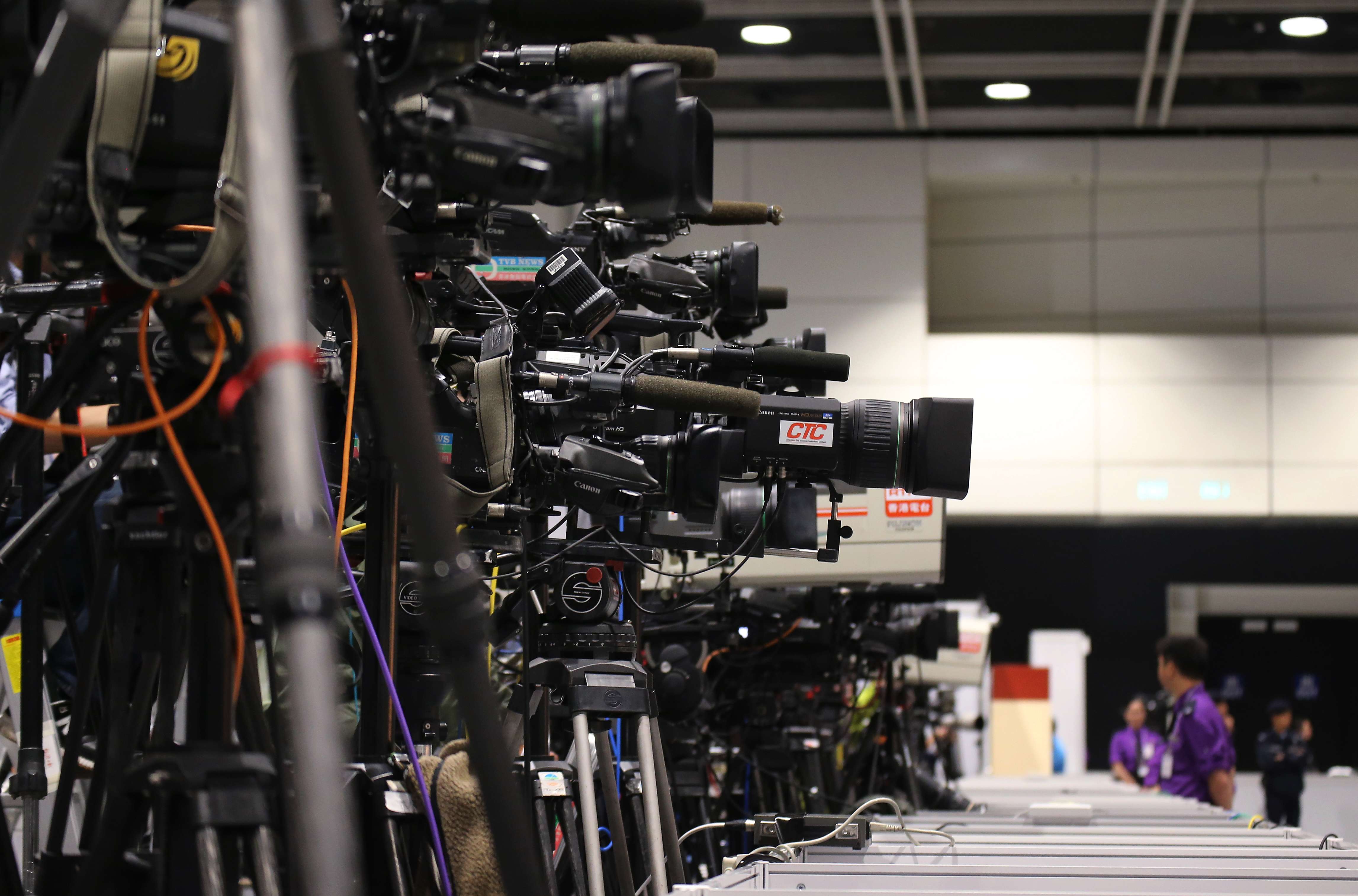 Cameras are fixed on Carrie Lam at the Convention and Exhibition Centre in Wan Chai after she is declared the winner of the chief executive election. Photo: Felix Wong