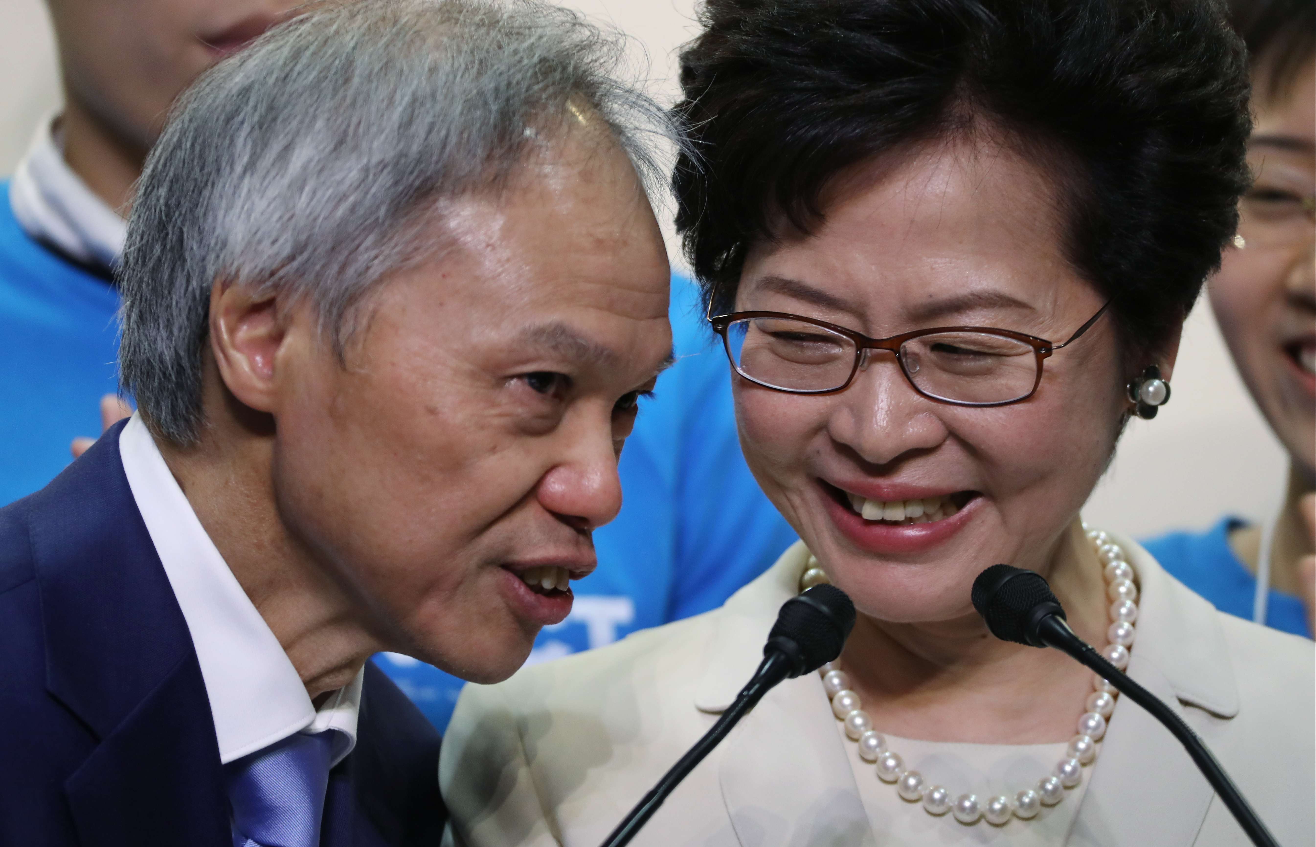Carrie Lam, with her husband Lam Siu-por, after her chief executive election win at the Hong Kong Convention and Exhibition Centre. Photo: Robert Ng
