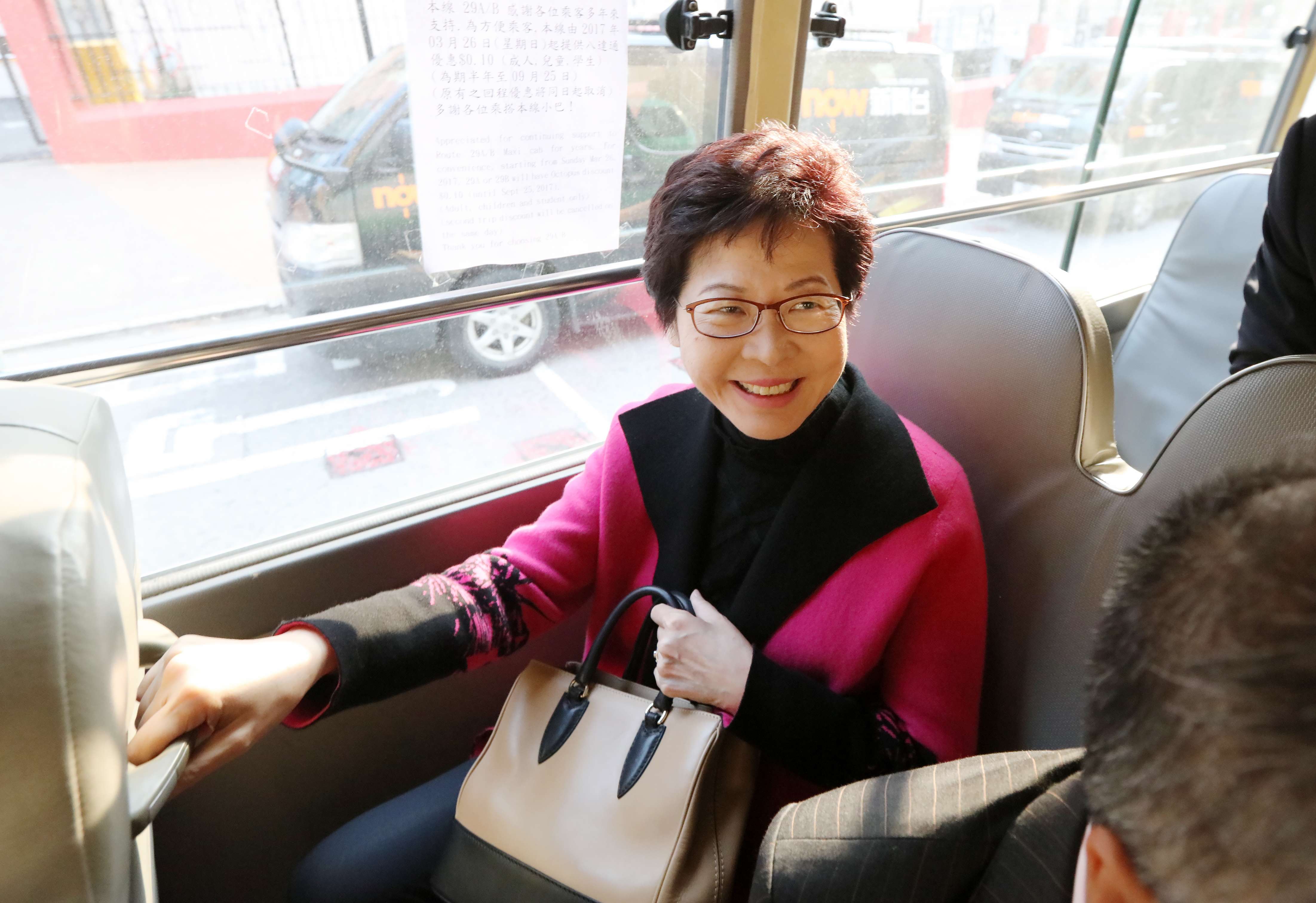 Chief executive-elect Carrie Lam arrives in Kowloon Tong on a minibus for her interview last week at Commercial Radio. Photo: Felix Wong