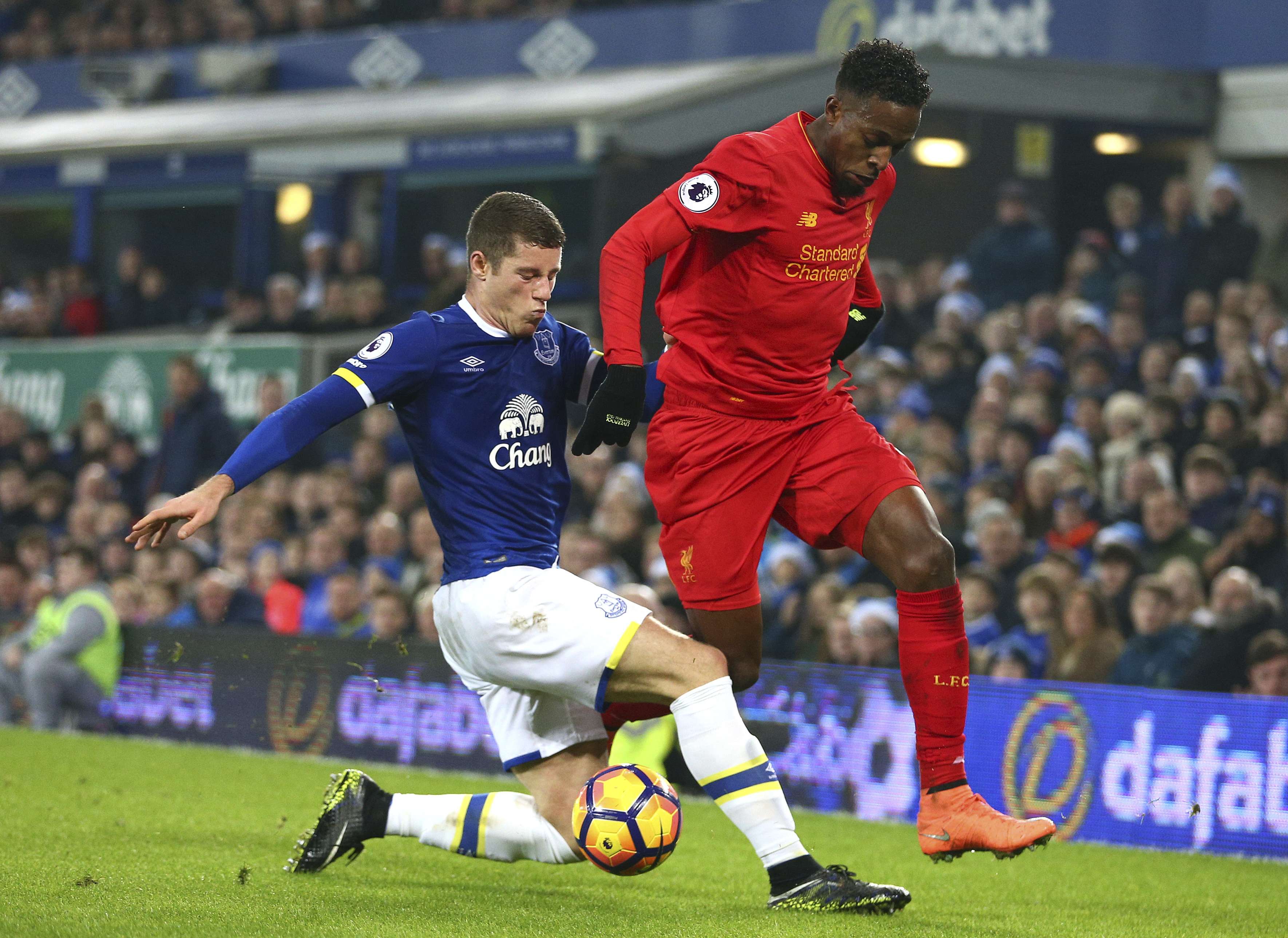 Liverpool's Divock Origi (right) and Everton's Ross Barkley at Anfield in December. Photo: AP