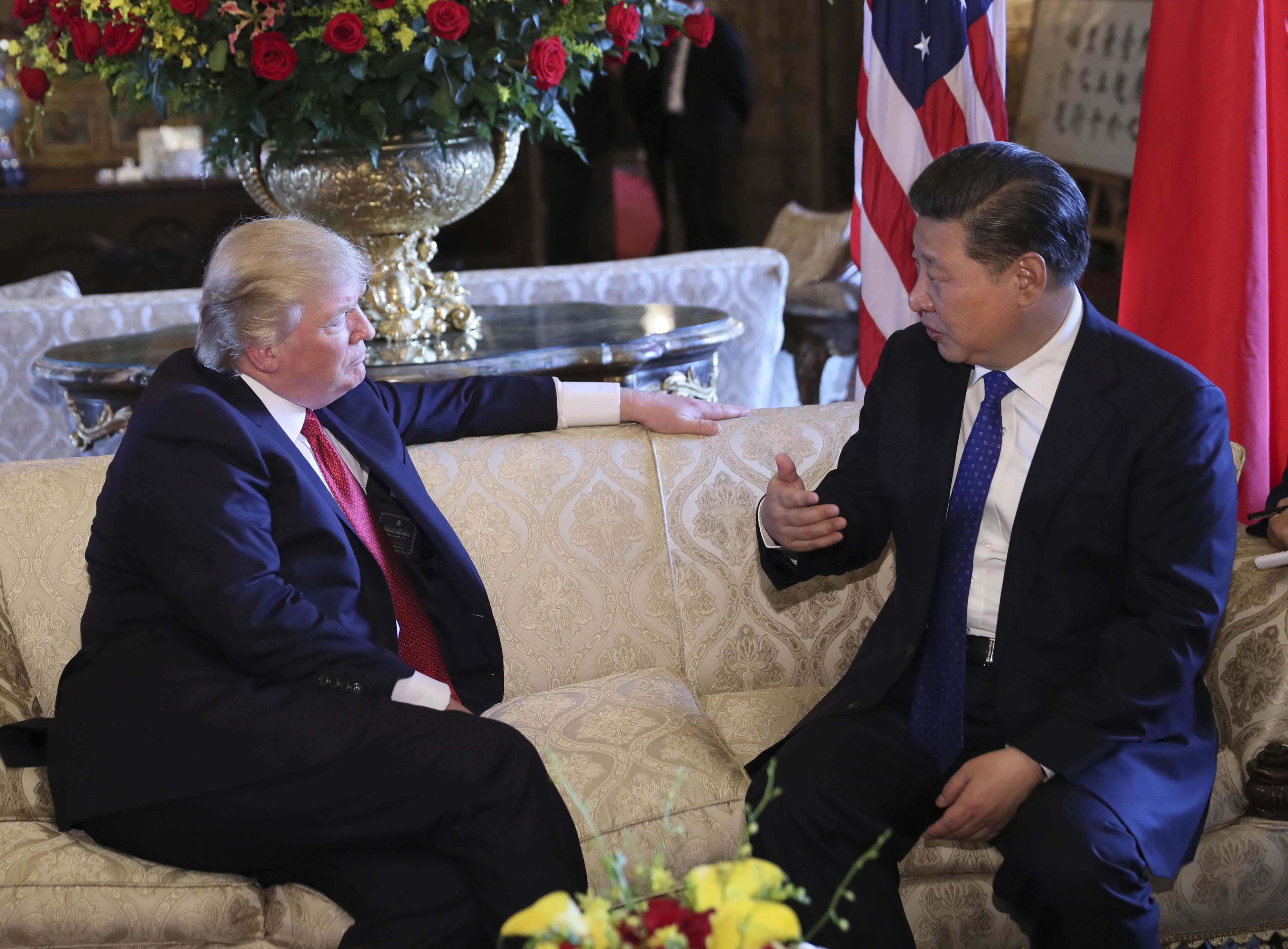 The Chinese media have played up a photo of the two leaders sitting on a sofa, with Xi gesticulating with his right hand to make a point as Trump listens in earnest. Photo: Xinhua