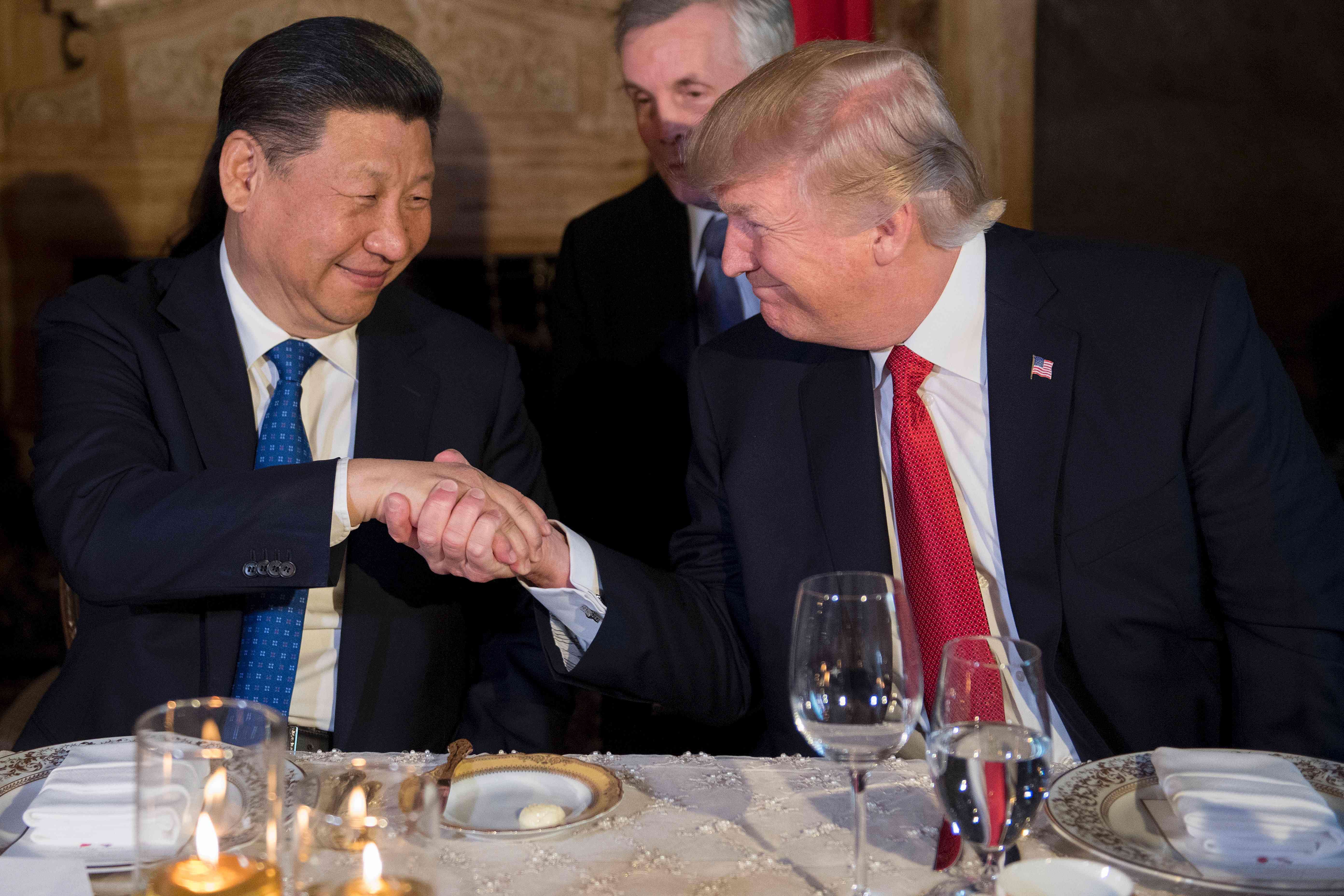 Chinese President Xi Jinping shake hands with US President Donald Trump during dinner at the Mar-a-Lago estate in Florida on Thursday. Photo: AFP