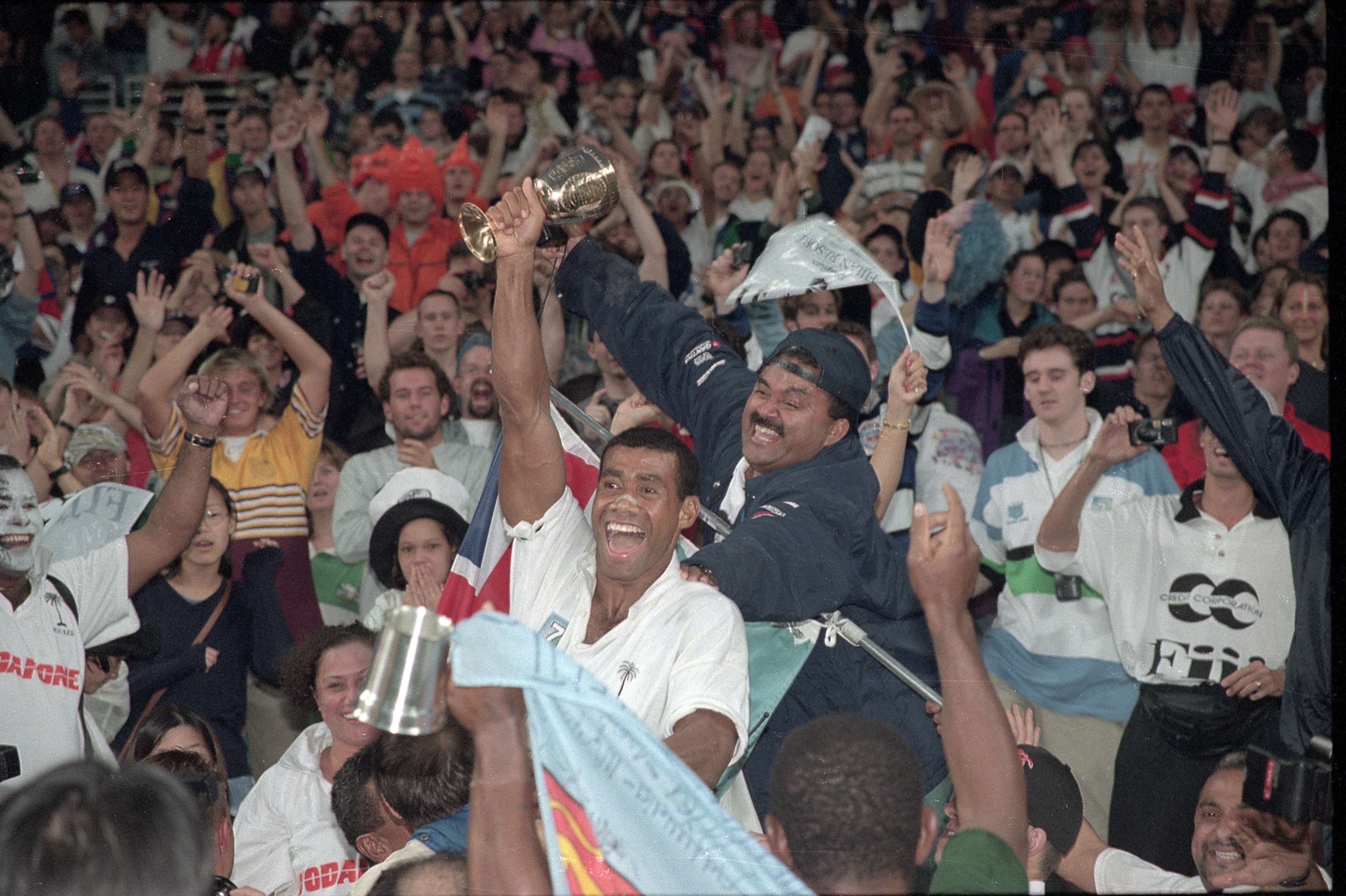Fiji captain Waisale Serevi, holding the Melrose Cup, celebrates victory in the 1997 Rugby World Cup Sevens final in Hong Kong on March 23, 1997. Photo: Martin Chan