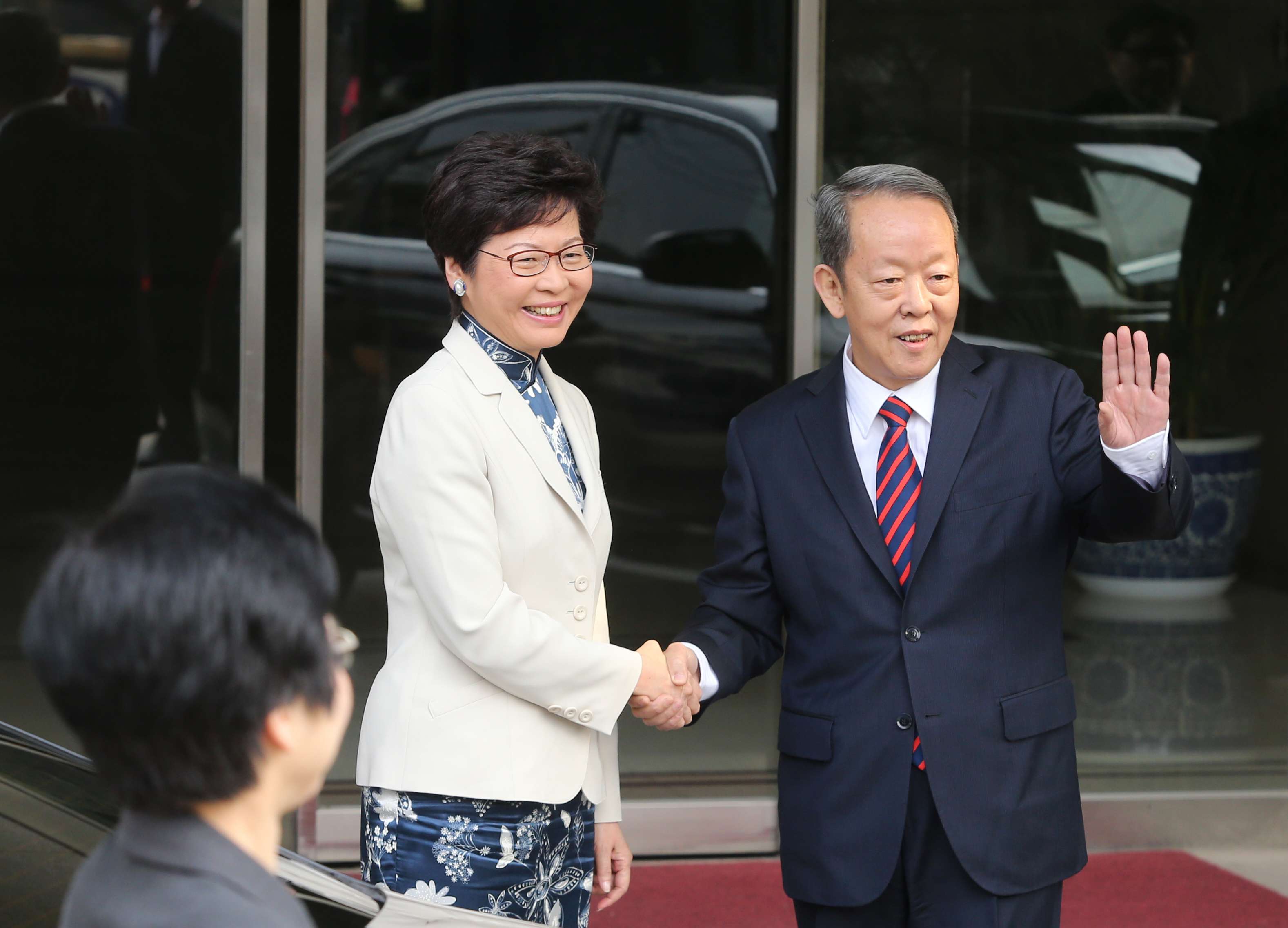 Chief executive-elect Carrie Lam greets Hong Kong and Macau Affairs Office director Wang Guangya in Beijing. Photo: Sam Tsang
