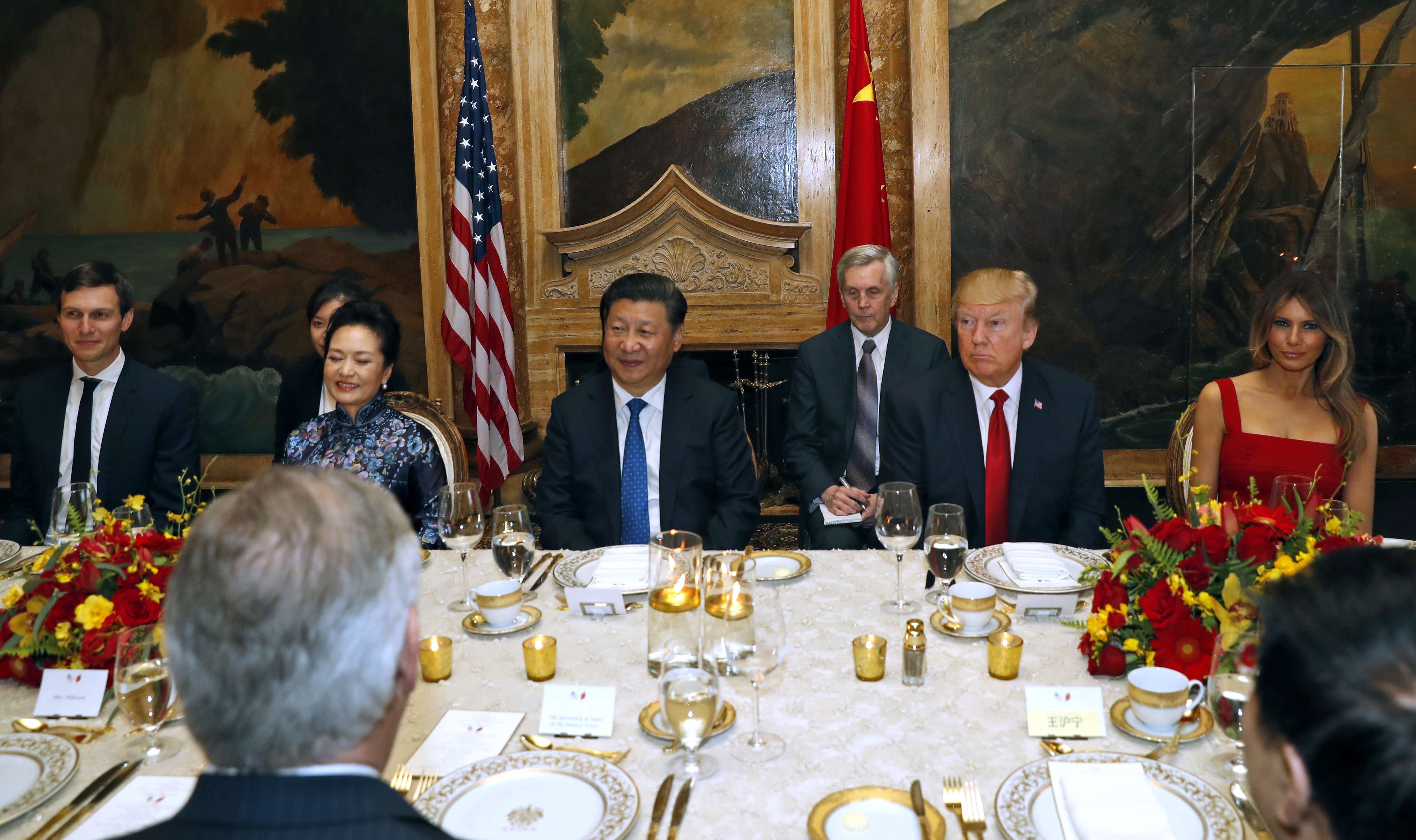 US President Donald Trump and Chinese President Xi Jinping, with their wives, first lady Melania Trump and Chinese first lady Peng Liyuan are seated during a dinner at Mar-a-Lago in Palm Beach. Photo: AP