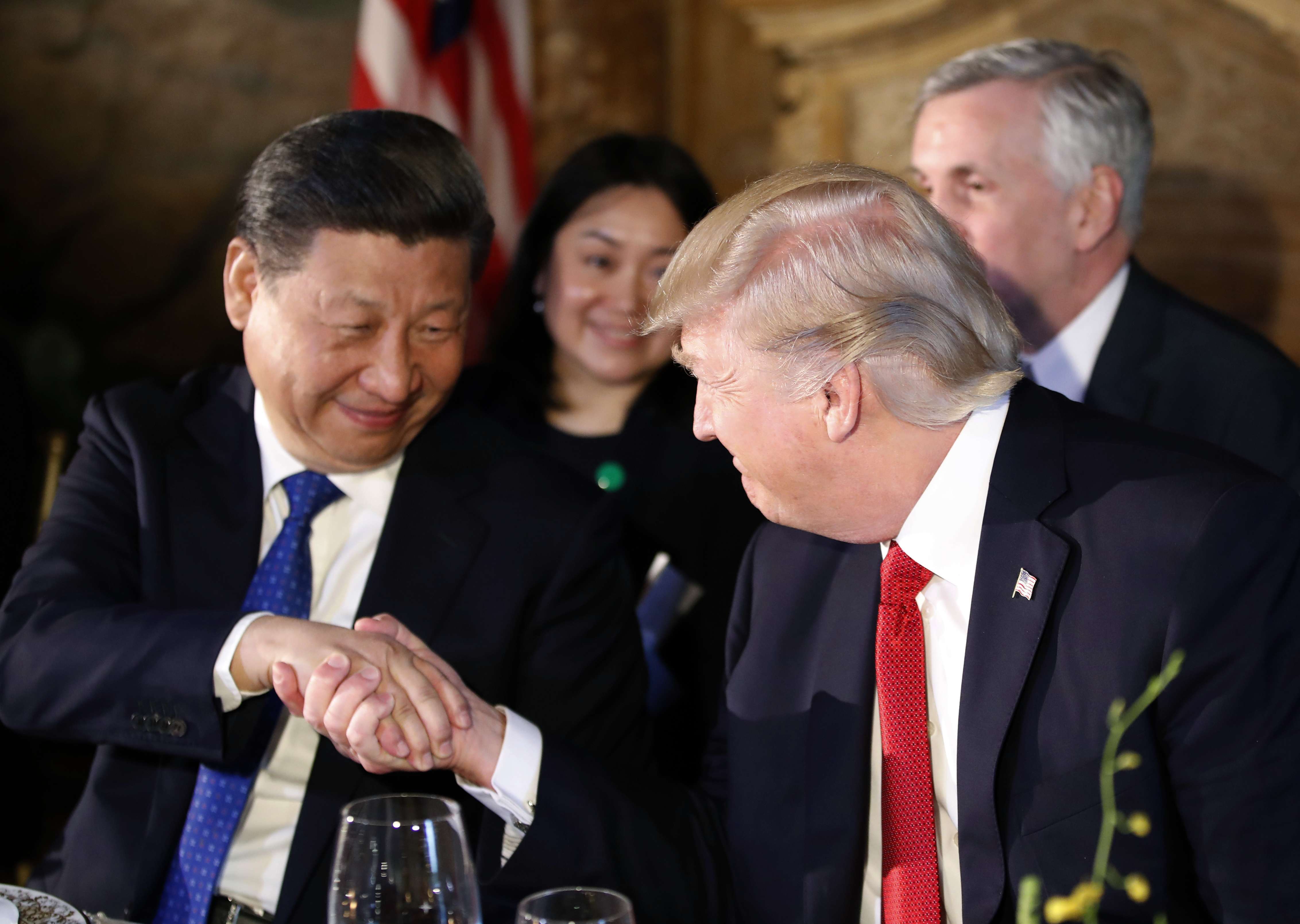 US President Donald Trump, right, shakes hands with Chinese President Xi Jinping during a dinner at Mar-a-Lago in Palm Beach. Photo: AP