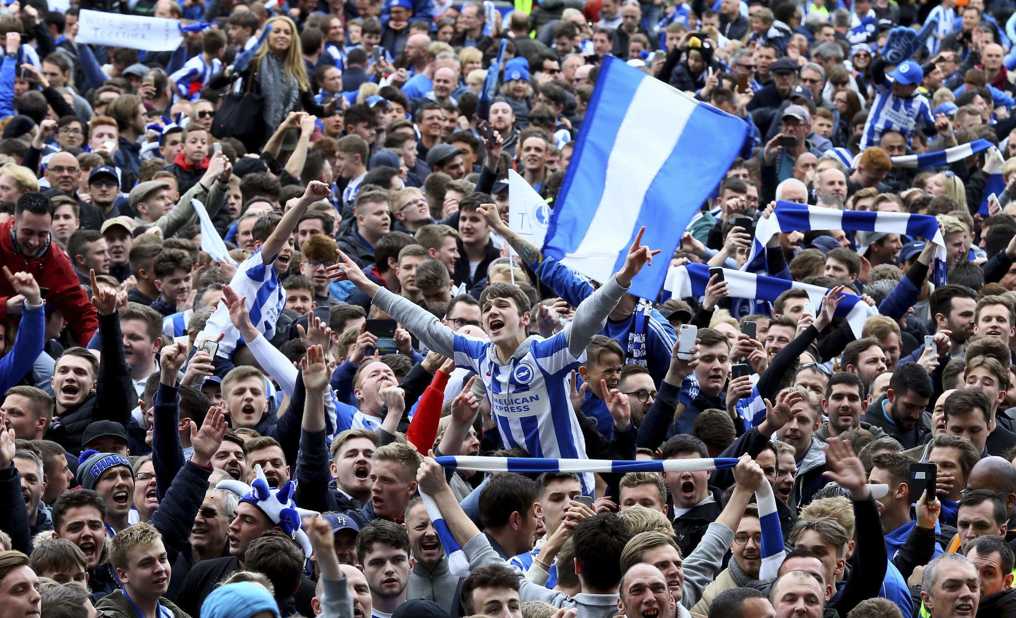 Brighton and Hove Albion fans celebrate their team’s return to the Premier League. Photo: AP