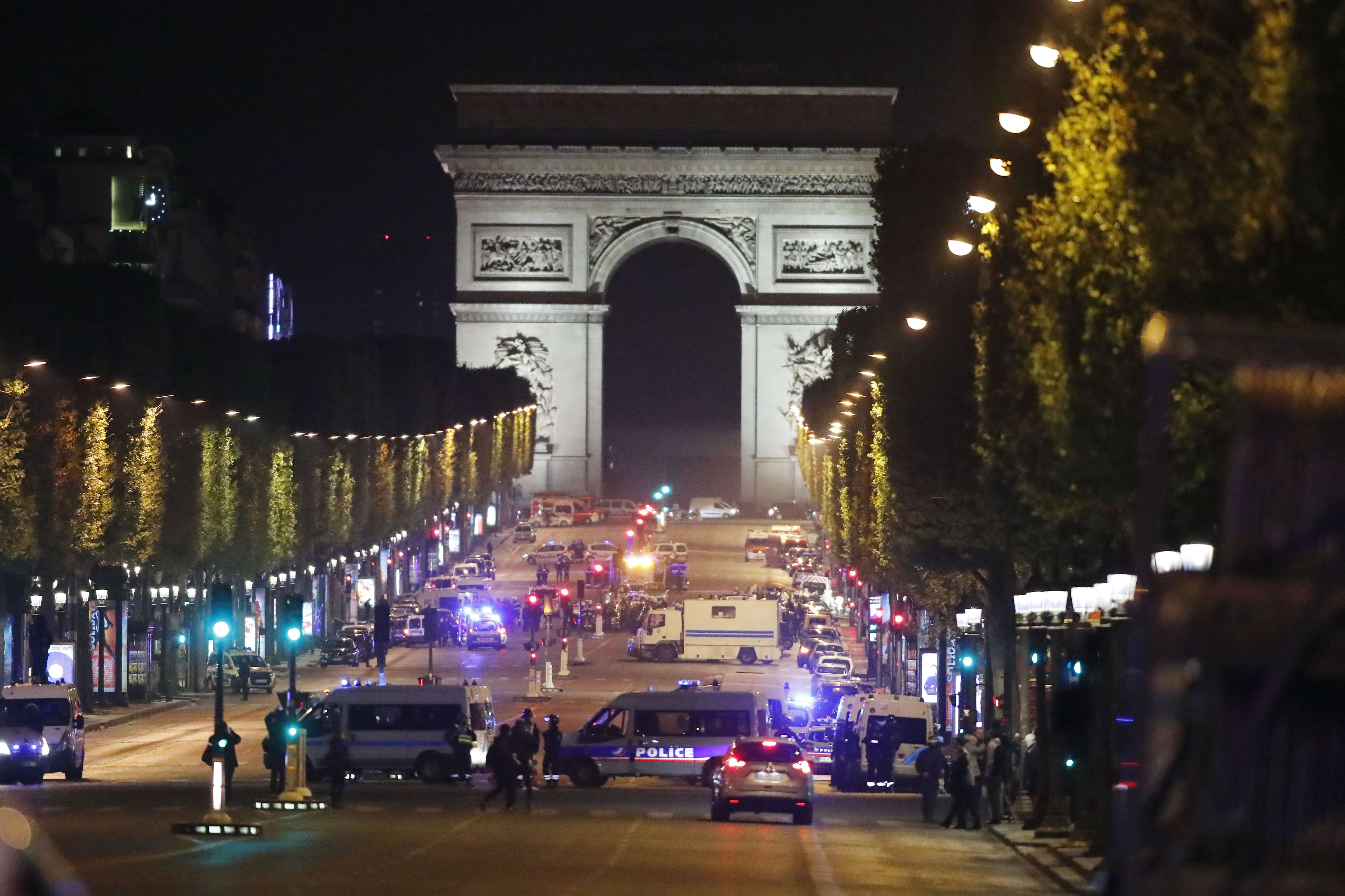 Machine gunfire erupts in the heart of the Paris tourist zone, as terror suspect riddles police car with bullets