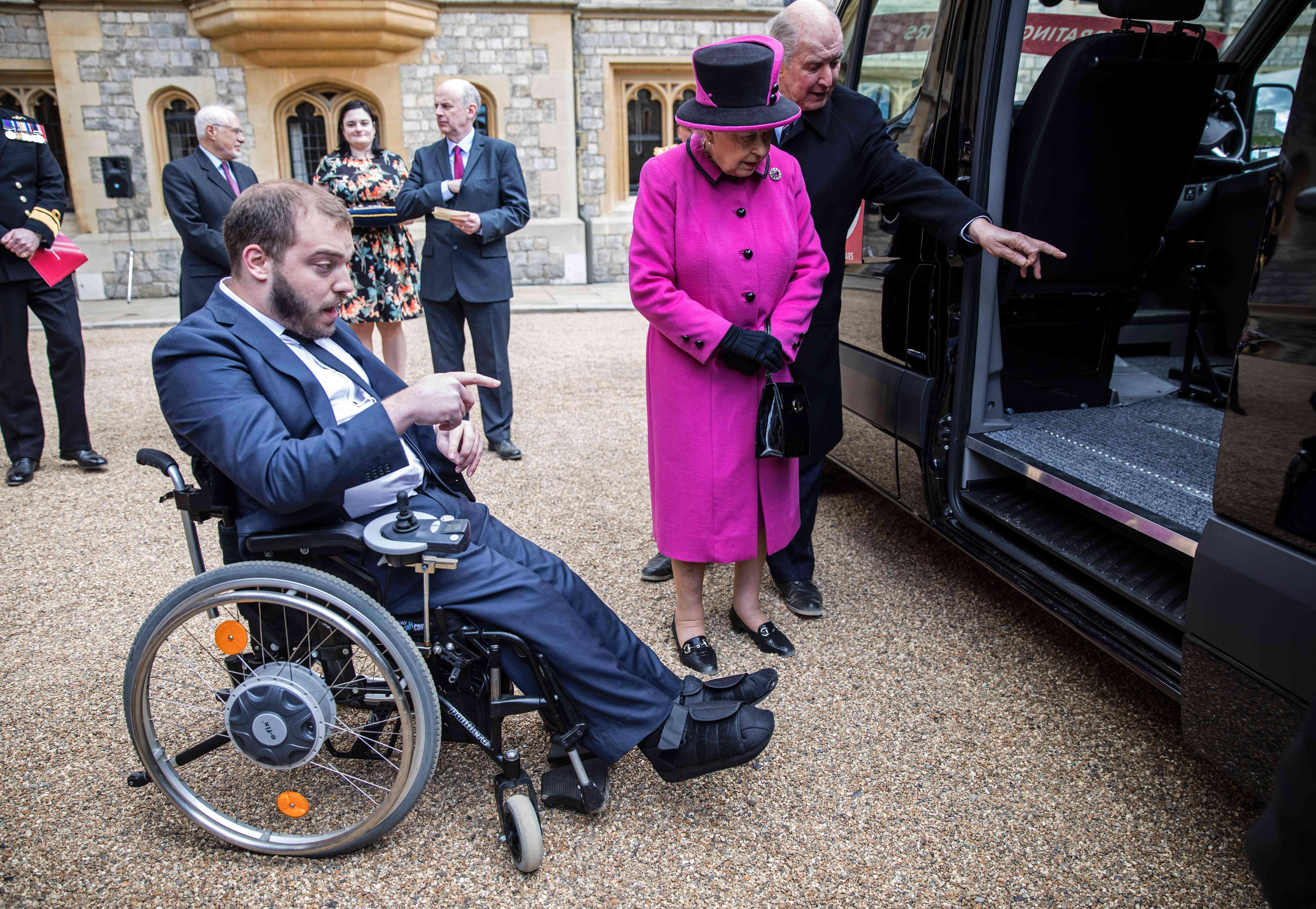 Queen Elizabeth hosts a ceremony to celebrate the 40th anniversary of British charity Motability, at Windsor Castle on April 25. Motability enables those with disabilities, their families and carers to lease a new car, scooter or powered wheelchair using their mobility allowance. Photo: AFP