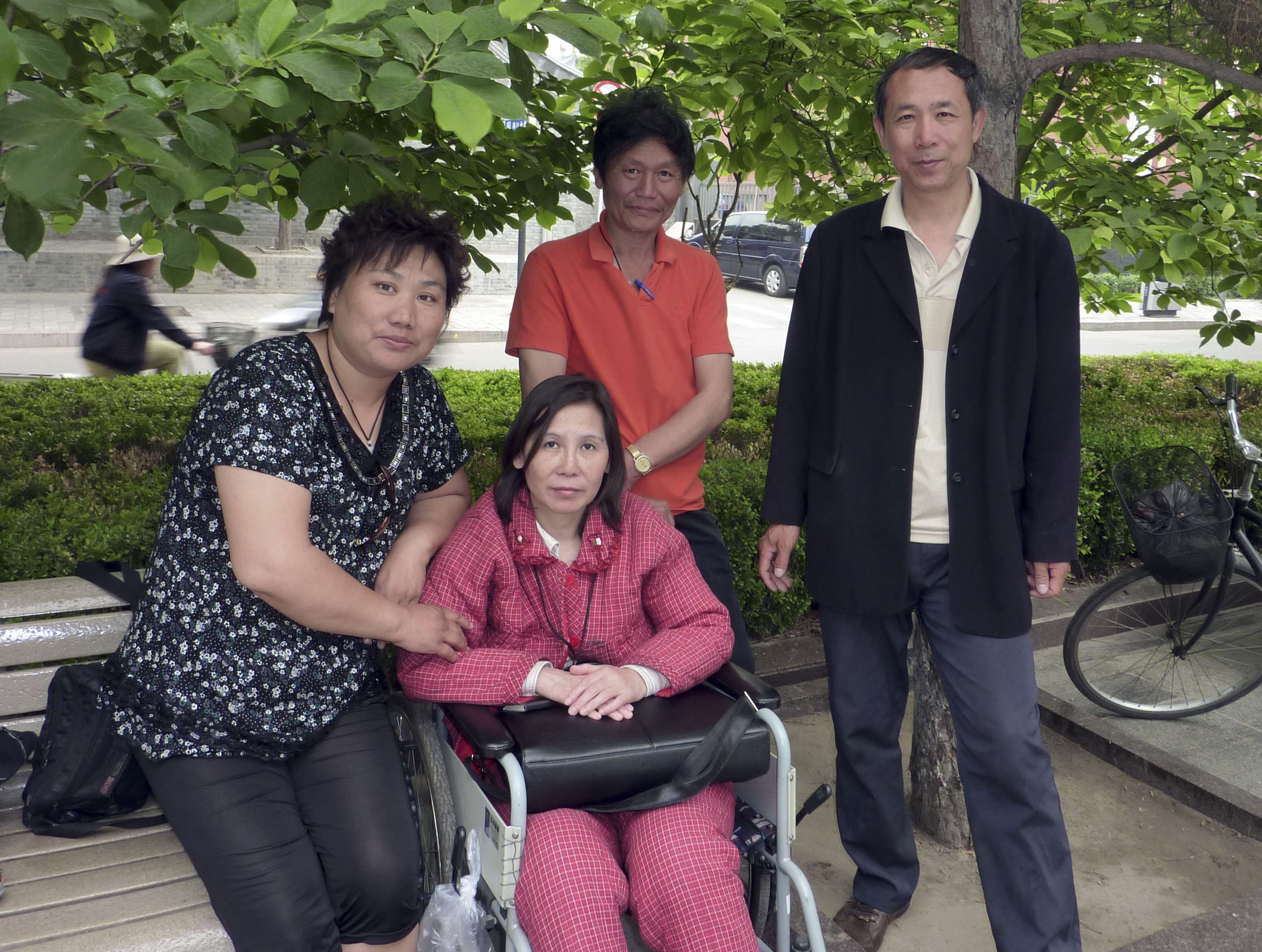 Activist Ni Yulan poses in 2010 with her husband Dong Jiqin (third from left) and friends. Photo: AFP