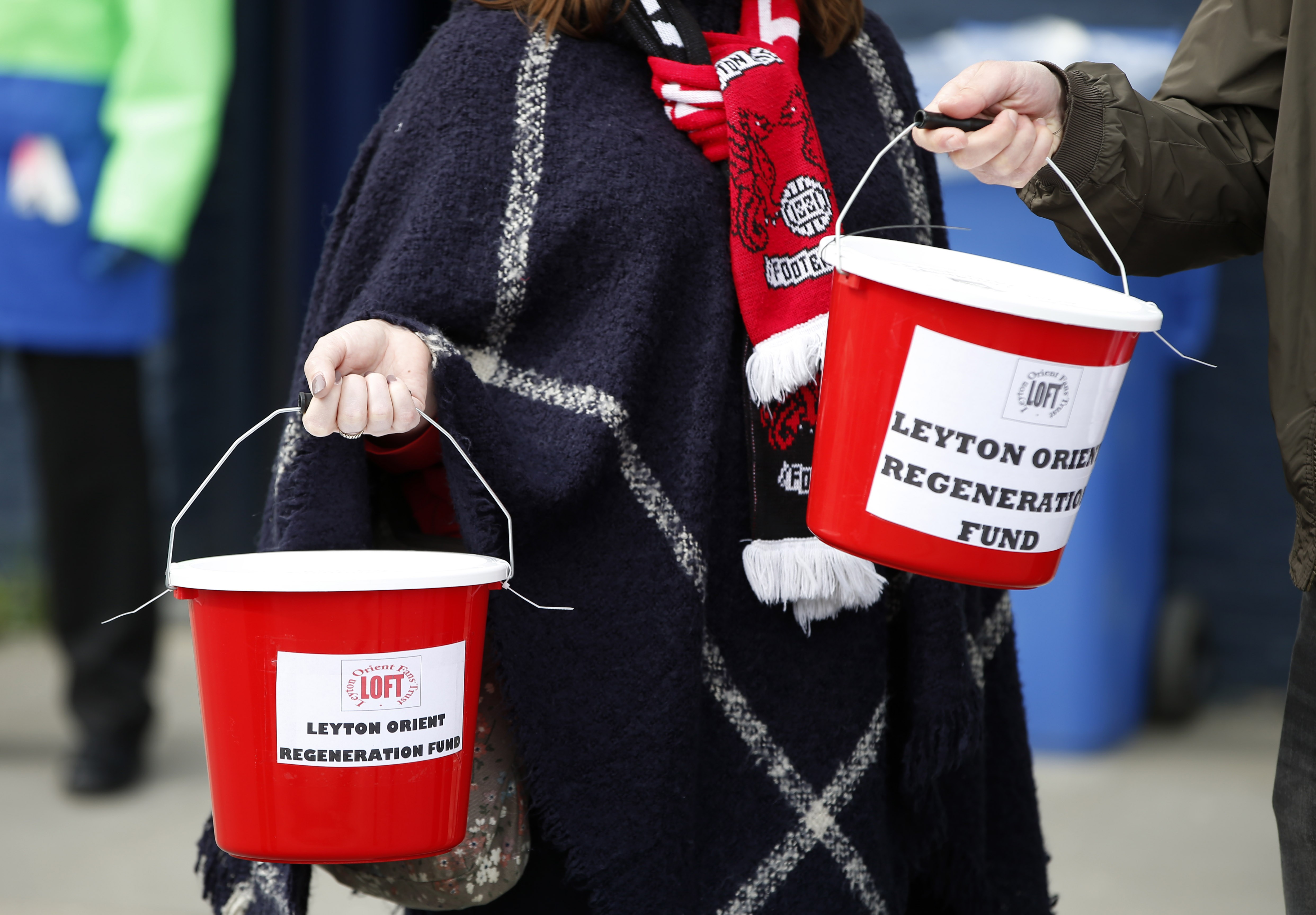 Leyton Orient fans collect money outside the ground. Photo: Reuters
