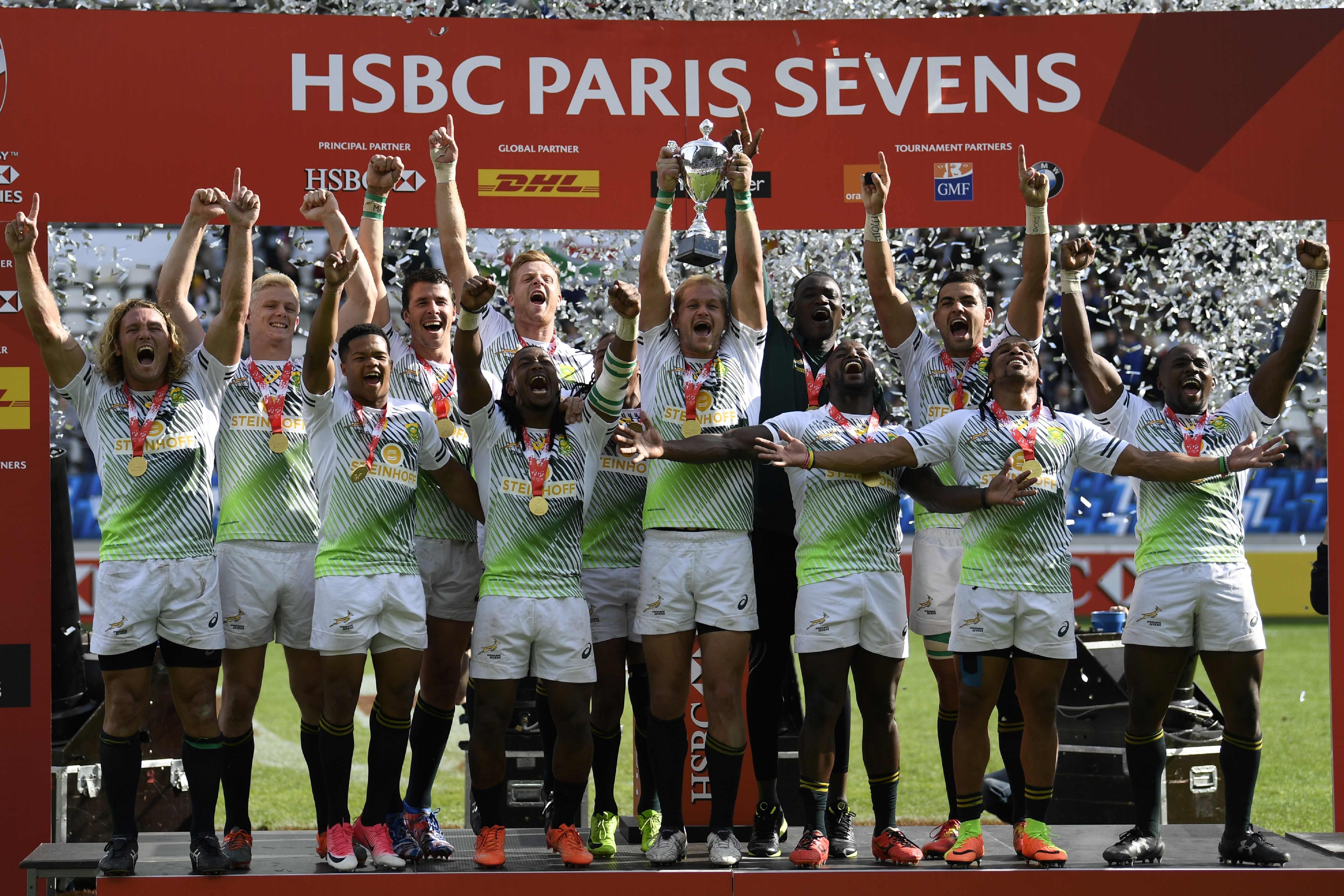 South Africa celebrate on the podium during the trophy ceremony after winning the Paris Sevens. Photo: AFP