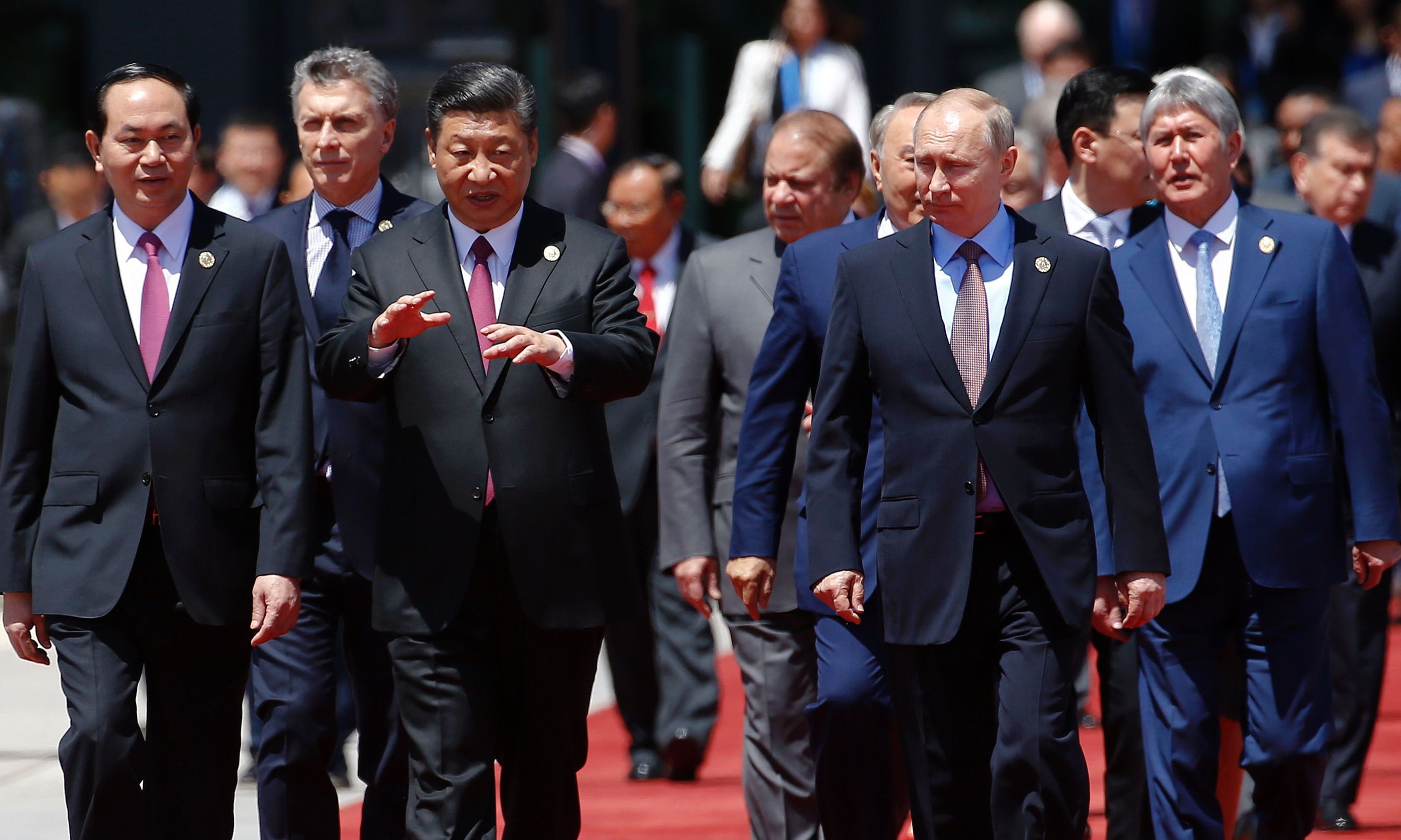President Xi Jinping (second from left) walks with Vietnamese President Tran Dai Quang and Russian President Vladimir Putin to have a group photo at the International Conference Centre in Yanqi Lake, north of Beijing, yesterday. Photo: AFP