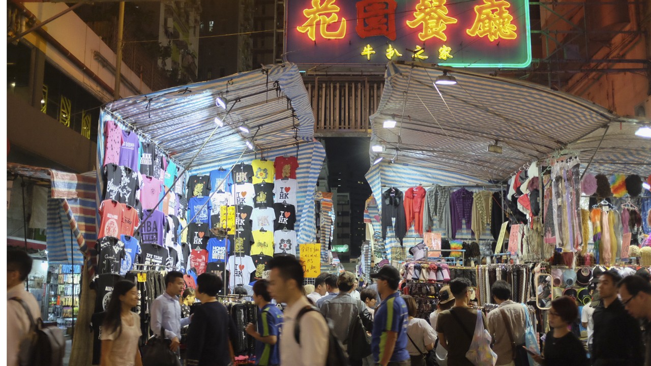 Football shirts for sale at a market stall, Ladies Market, Mongkok