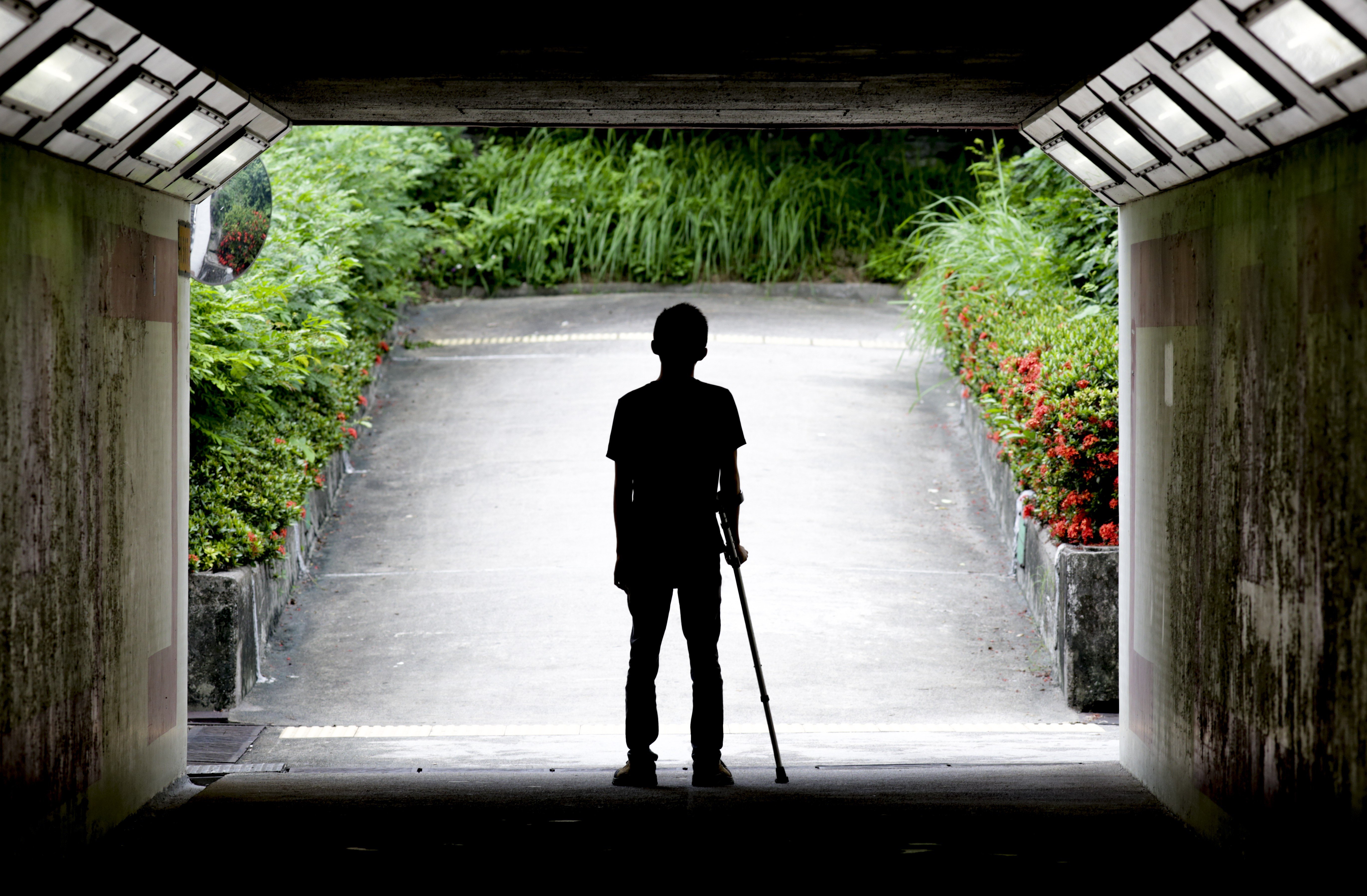 Hong Kong student Victor still requires a walking stick following his Shenzhen ordeal with a suspected fake doctor. Photo: James Wendlinger