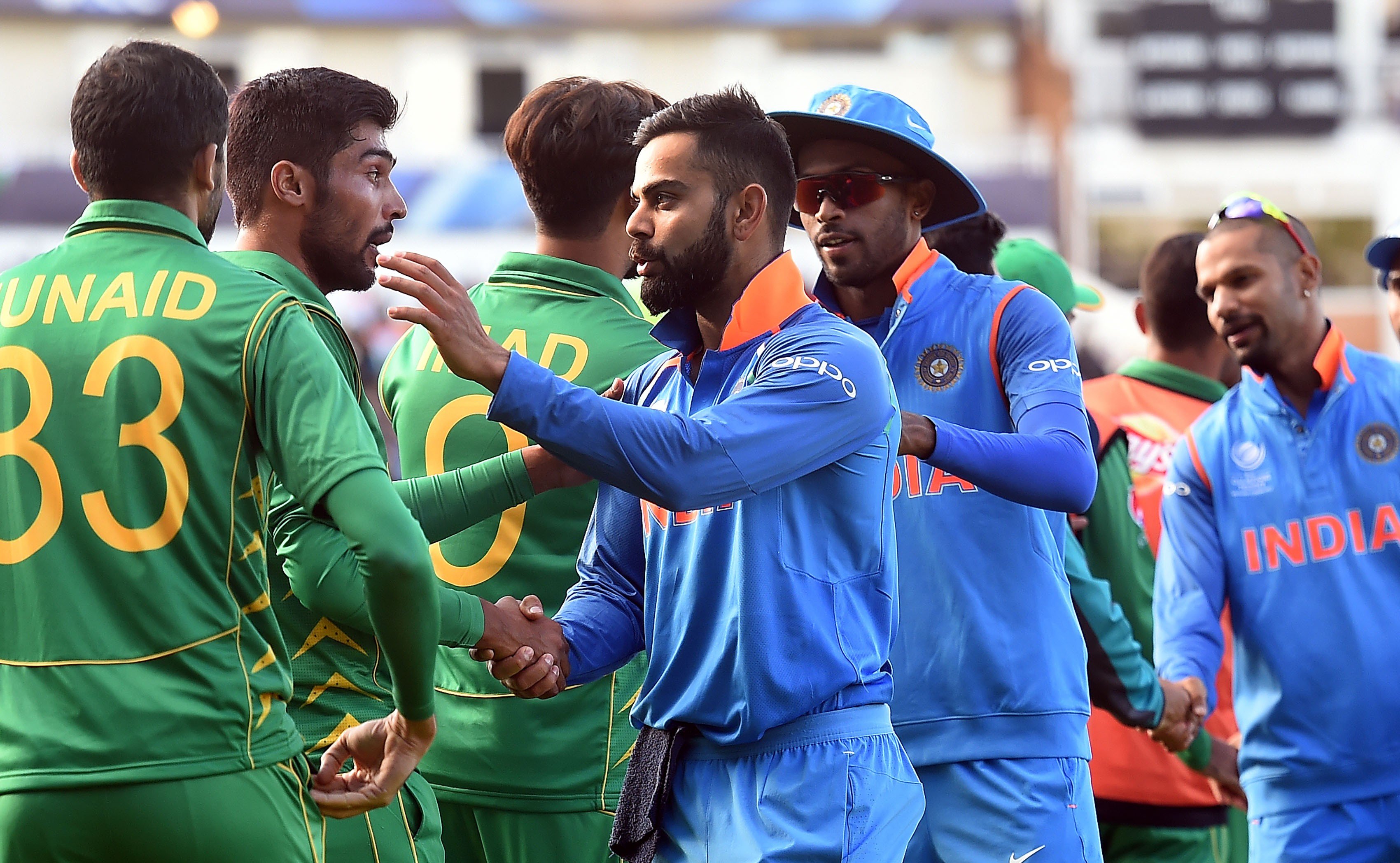 India captain Virat Kohli shakes hands with Pakistan players after their ICC Champions Trophy match. Photo: AFP