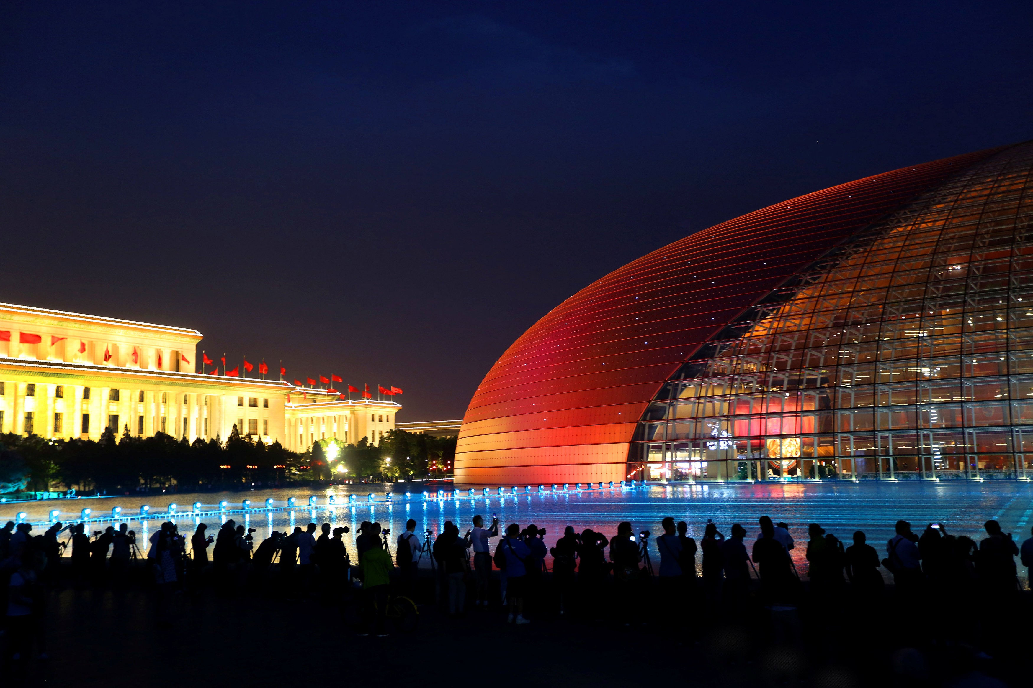 An illuminated Grand National Theatre draws admiring crowds ahead of the Belt and Road Forum in Beijing, on May 12. Western classical music and grand opera are integral parts of cultural life in Beijing and Shanghai. Photo: Reuters
