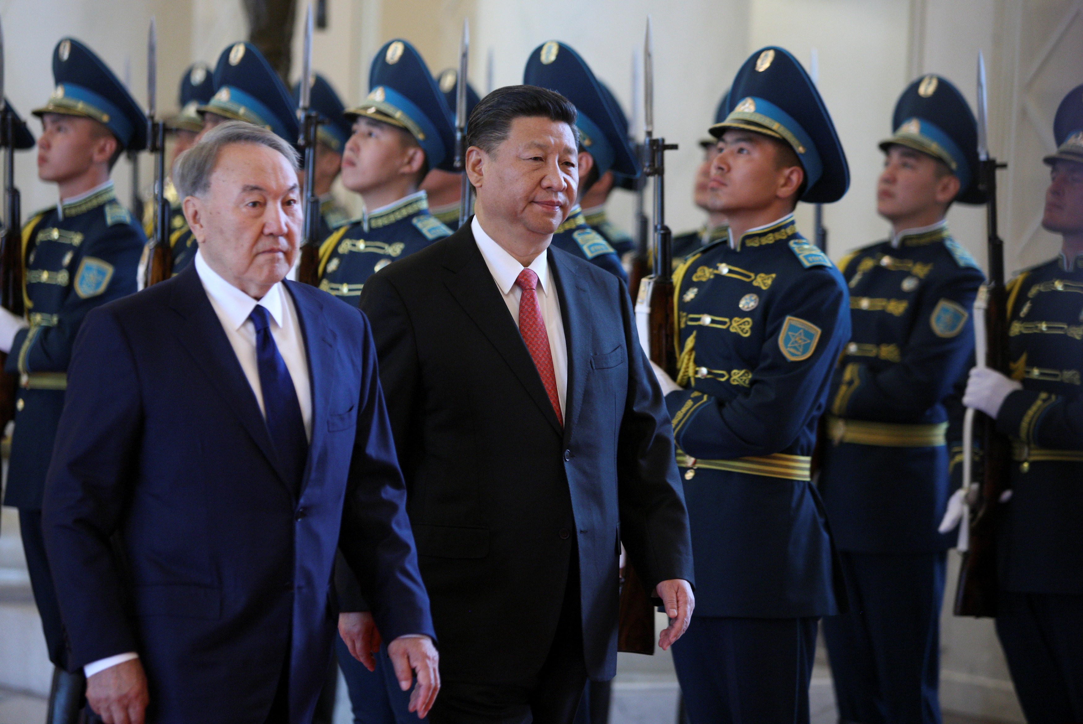Kazakh president Nursultan Nazarbayev and China’s Xi Jinping review the honour guard during a welcoming ceremony before their meeting as part of the Shanghai Cooperation Organisation in Astana. Photo: Reuters