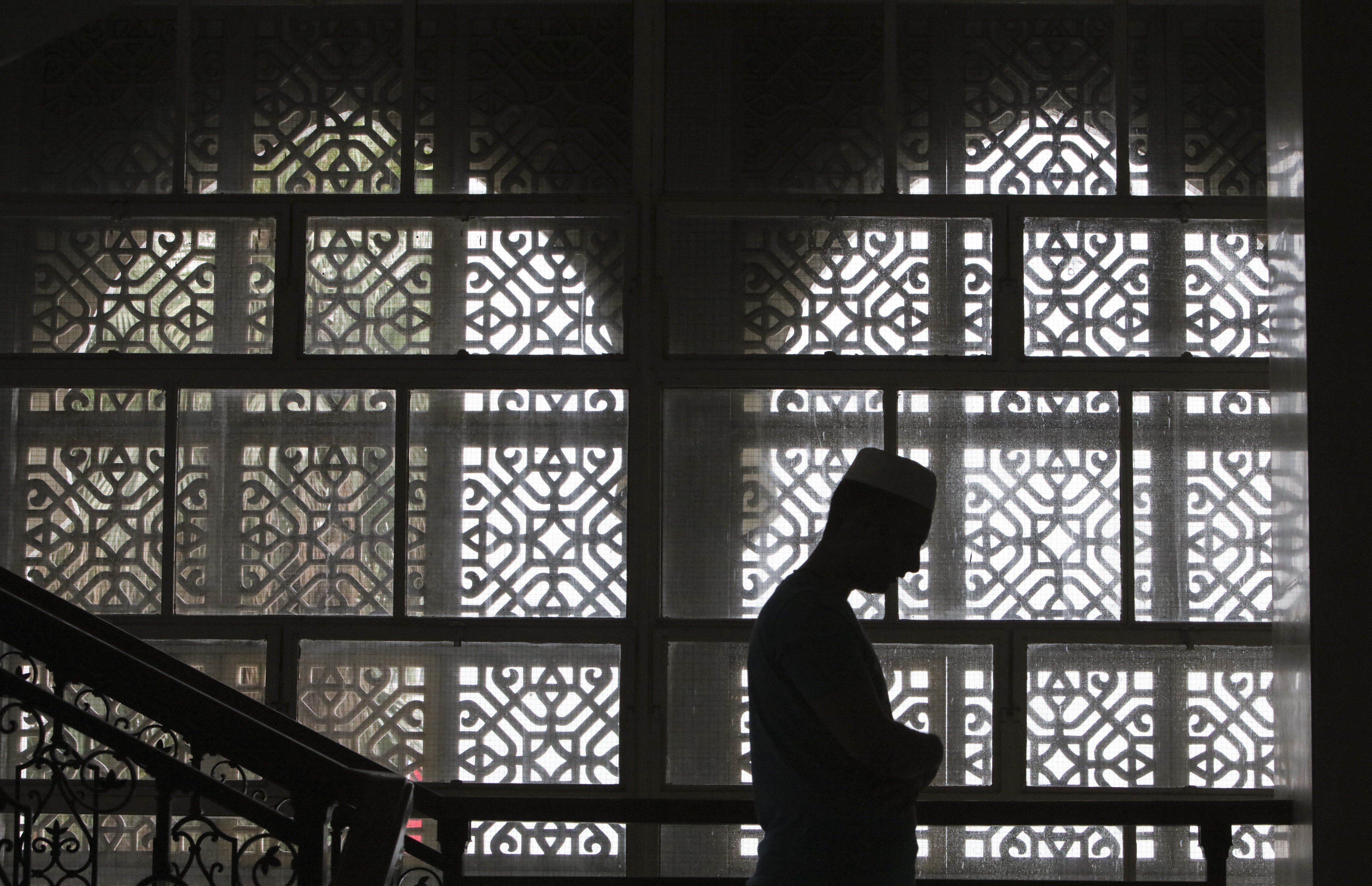 A man prays at the Kowloon Mosque in Tsim Sha Tsui, on June 1. If terrorism did have something to do with Islam, “Islamic” terrorism would be a centuries-old problem. Photo: Felix Wong