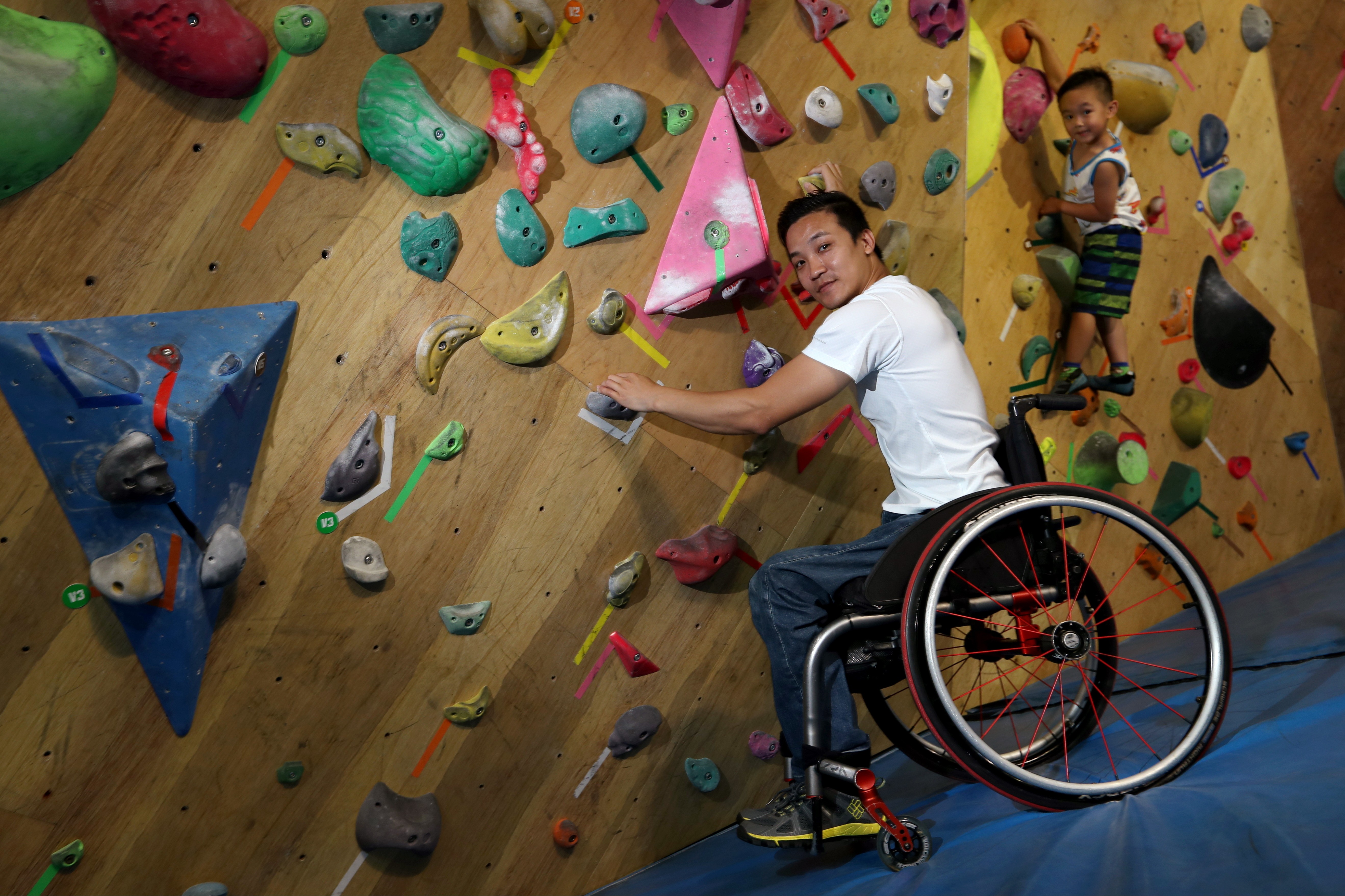 Lai Chi-wai, with his son Gordon, at a climbing centre. Photo: Nora Tam