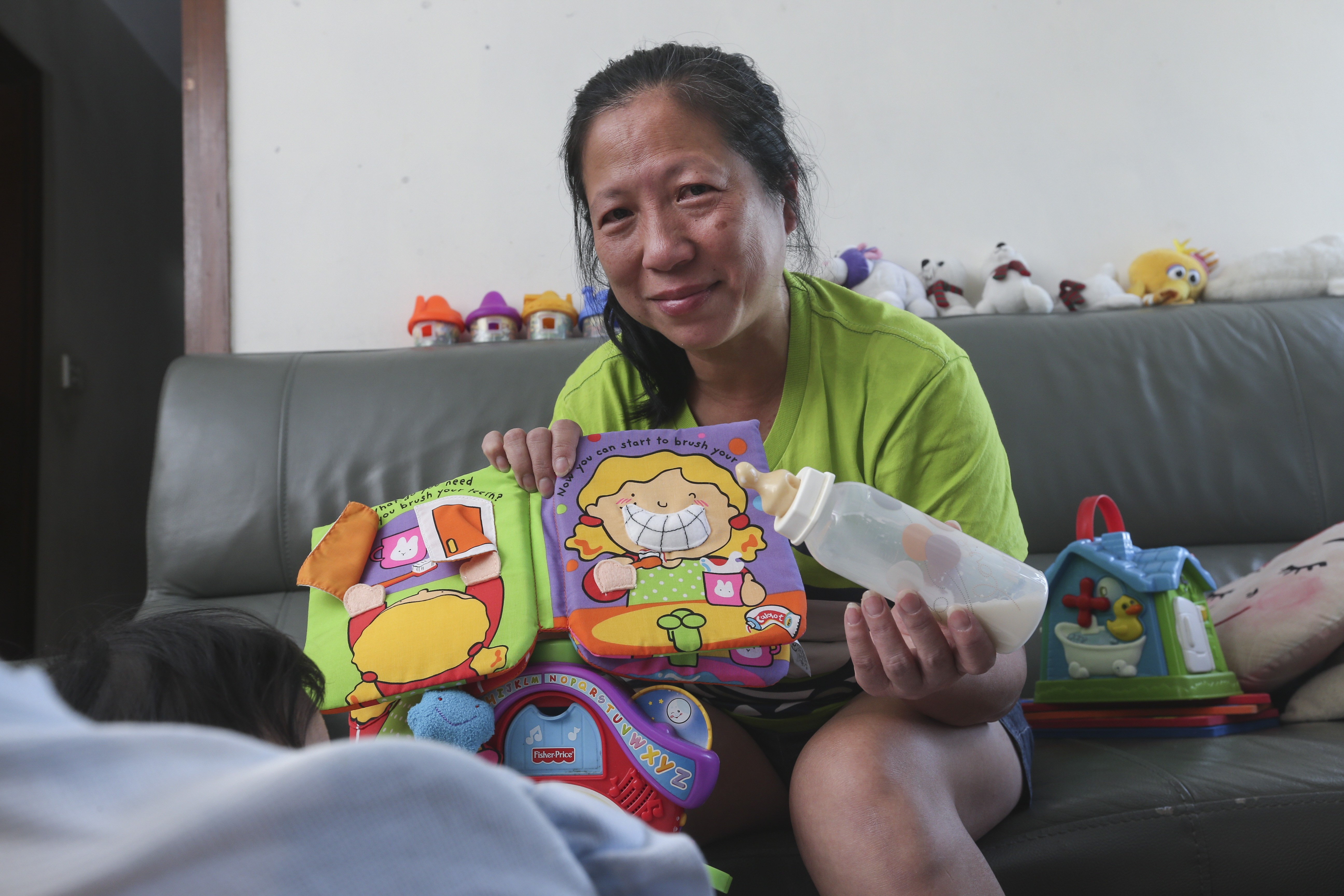 Chin Pui-chun is never happier than when she has a child to take care of. Photo: K. Y. Cheng
