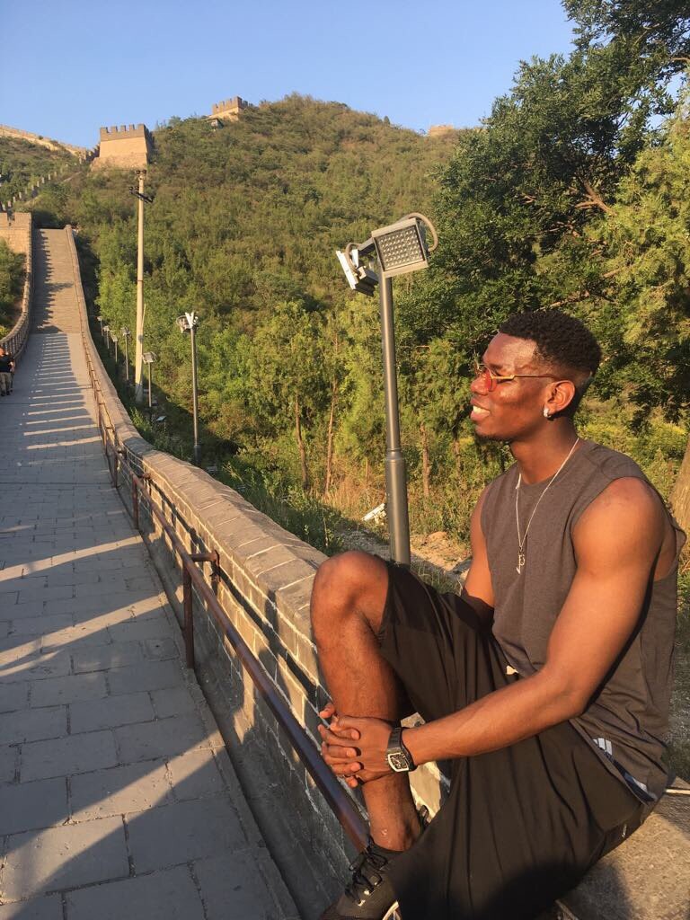 Paul Pogba sits on the Great Wall of China. Photo: @paulpogba
