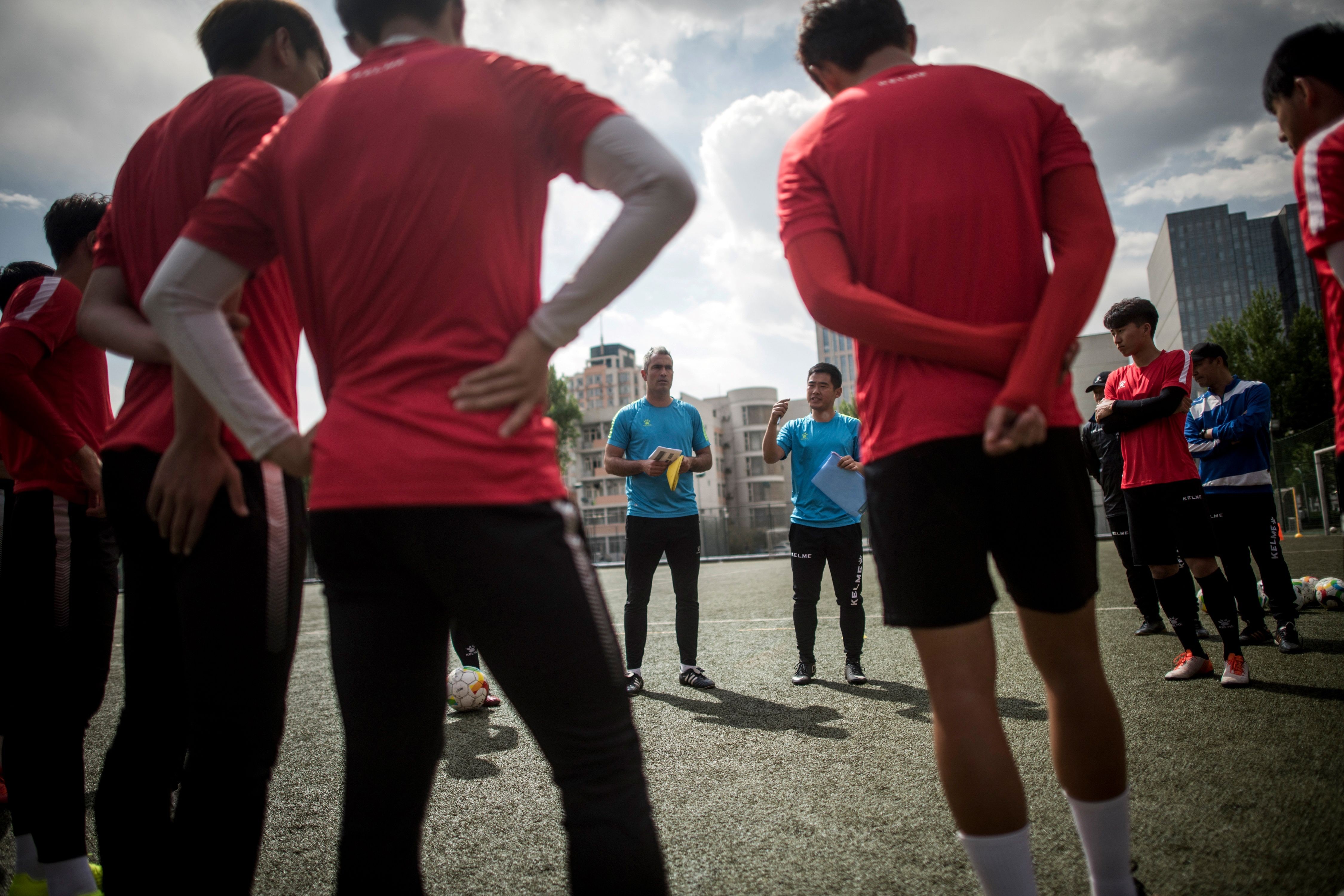 Beijing Institute of Technology’s Spanish head coach Roberto Ahufinger del Pino (centre) talks during a training session. Photo: AFP