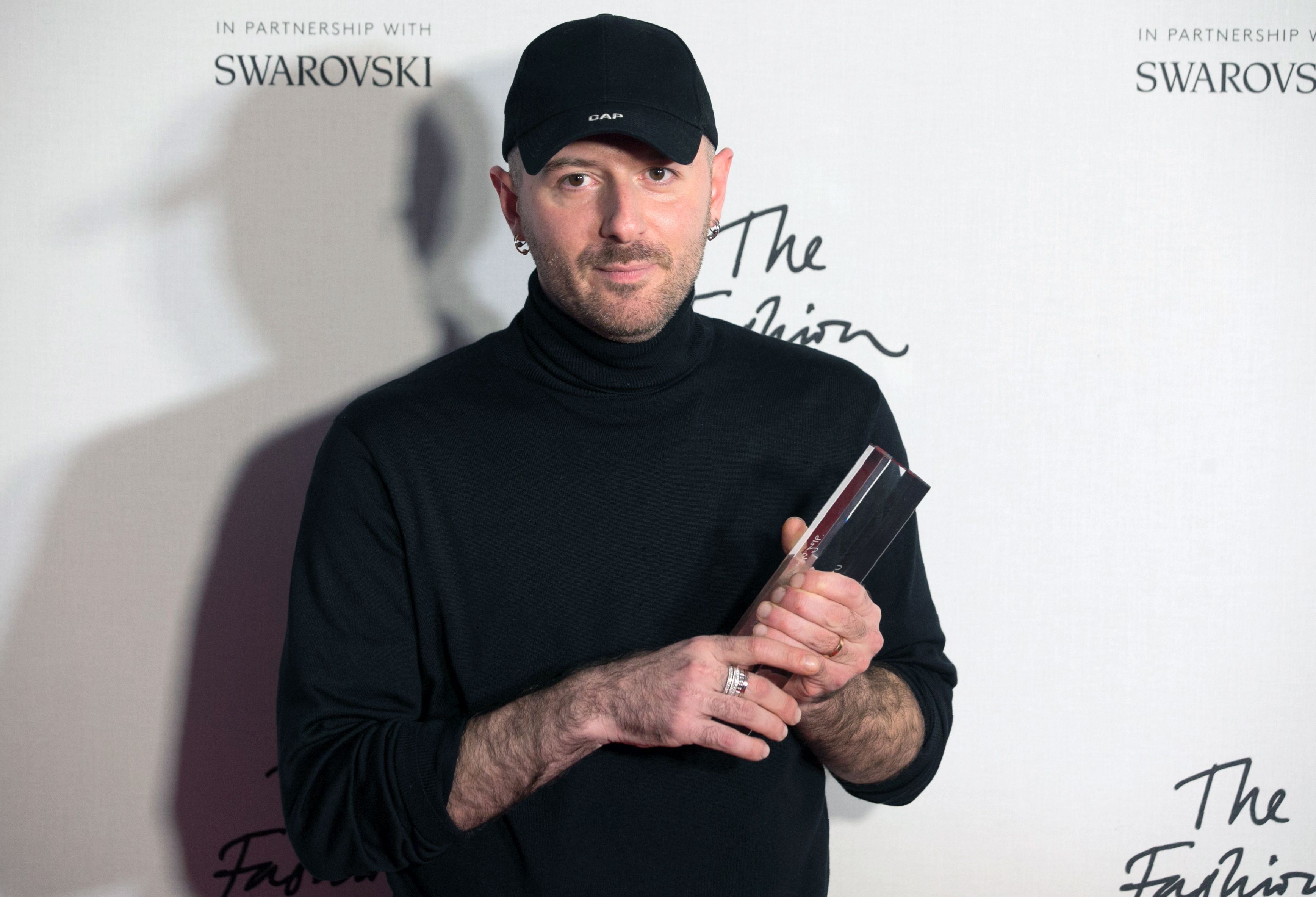 Designer Demna Gvasalia of fashion house Balenciaga poses with his award after being named winner of the International Ready-to-Wear Designer award during the British Fashion Awards 2016 in London. Photo: AFP