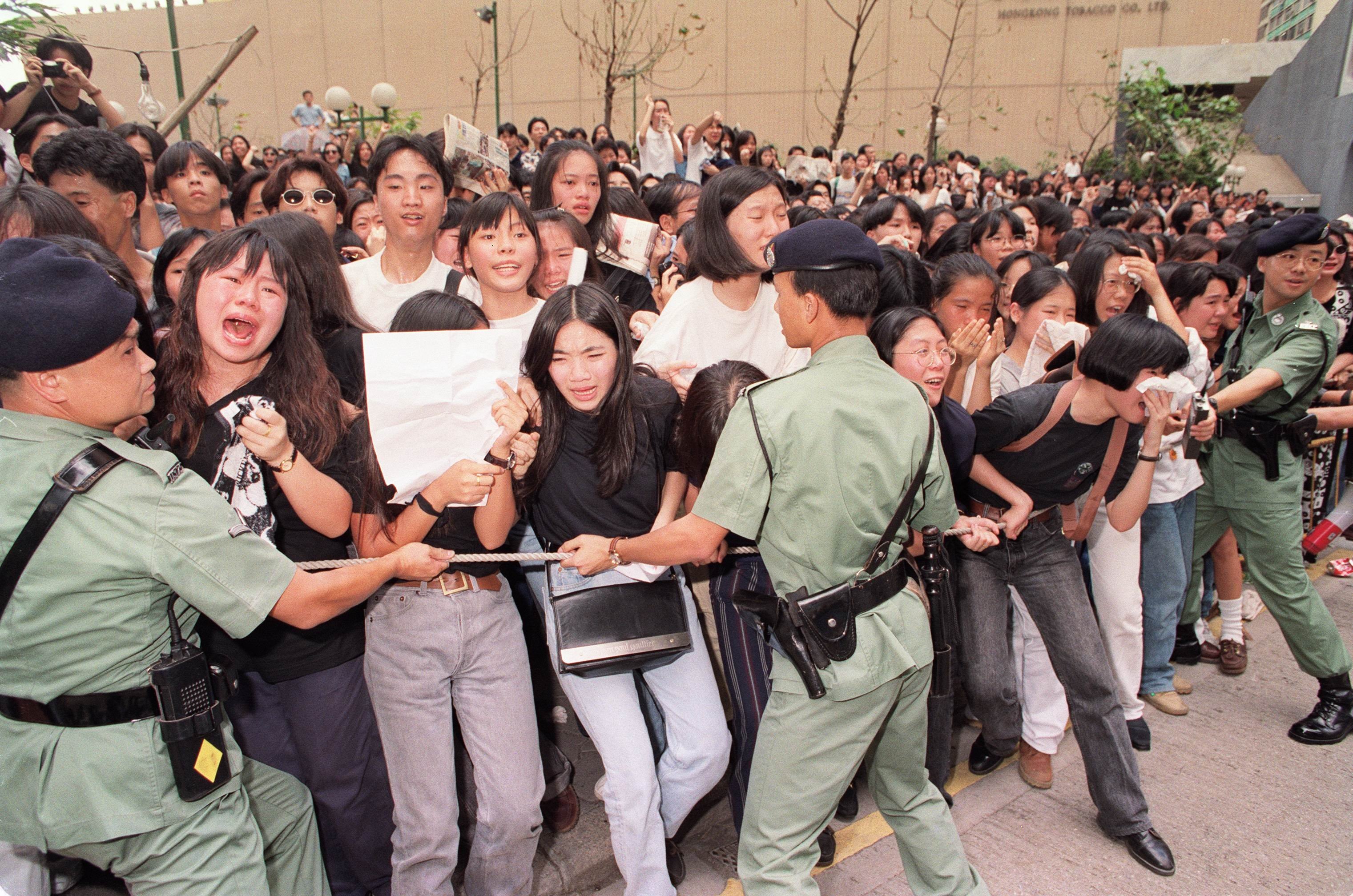 Fans distraught as the hearse carrying Wong Ka-kui leaves Hong Kong Funeral Parlour, in July 1993. Picture: SCMP