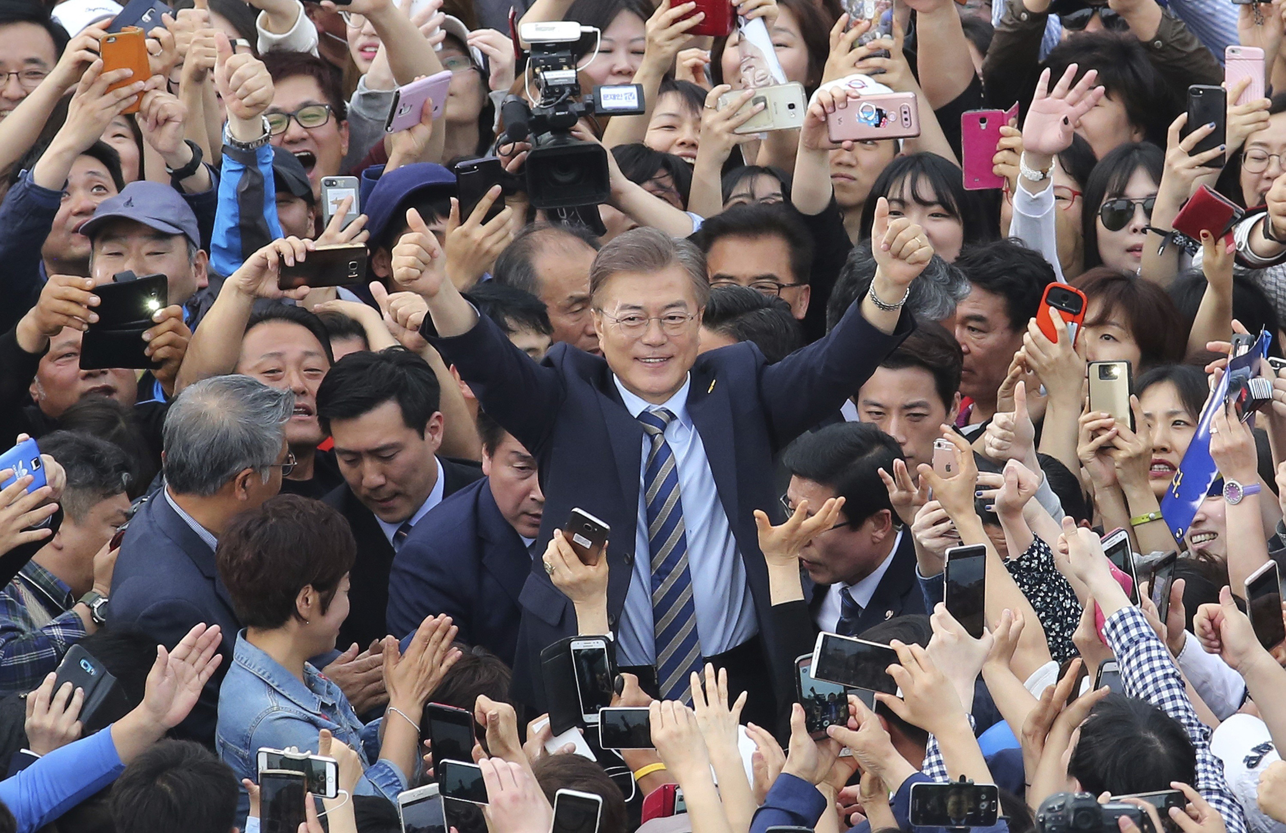 Fawning media coverage has made the South Korean leader more popular than ever, but critics fear there is a dark side to Moon Jae-in – his snuggling up to North Korea
