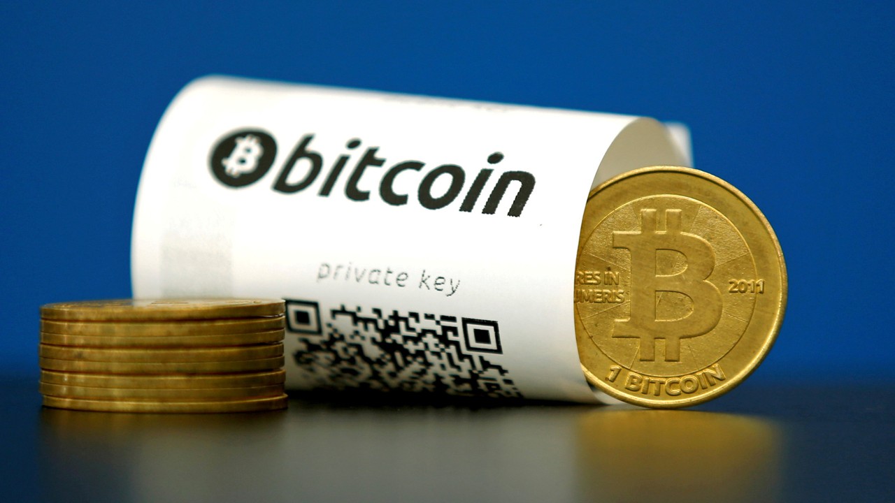 A Bitcoin (virtual currency) paper wallet with QR codes and a coin are seen in an illustration picture taken at La Maison du Bitcoin in Paris, France. Photo: REUTERS/Benoit Tessier