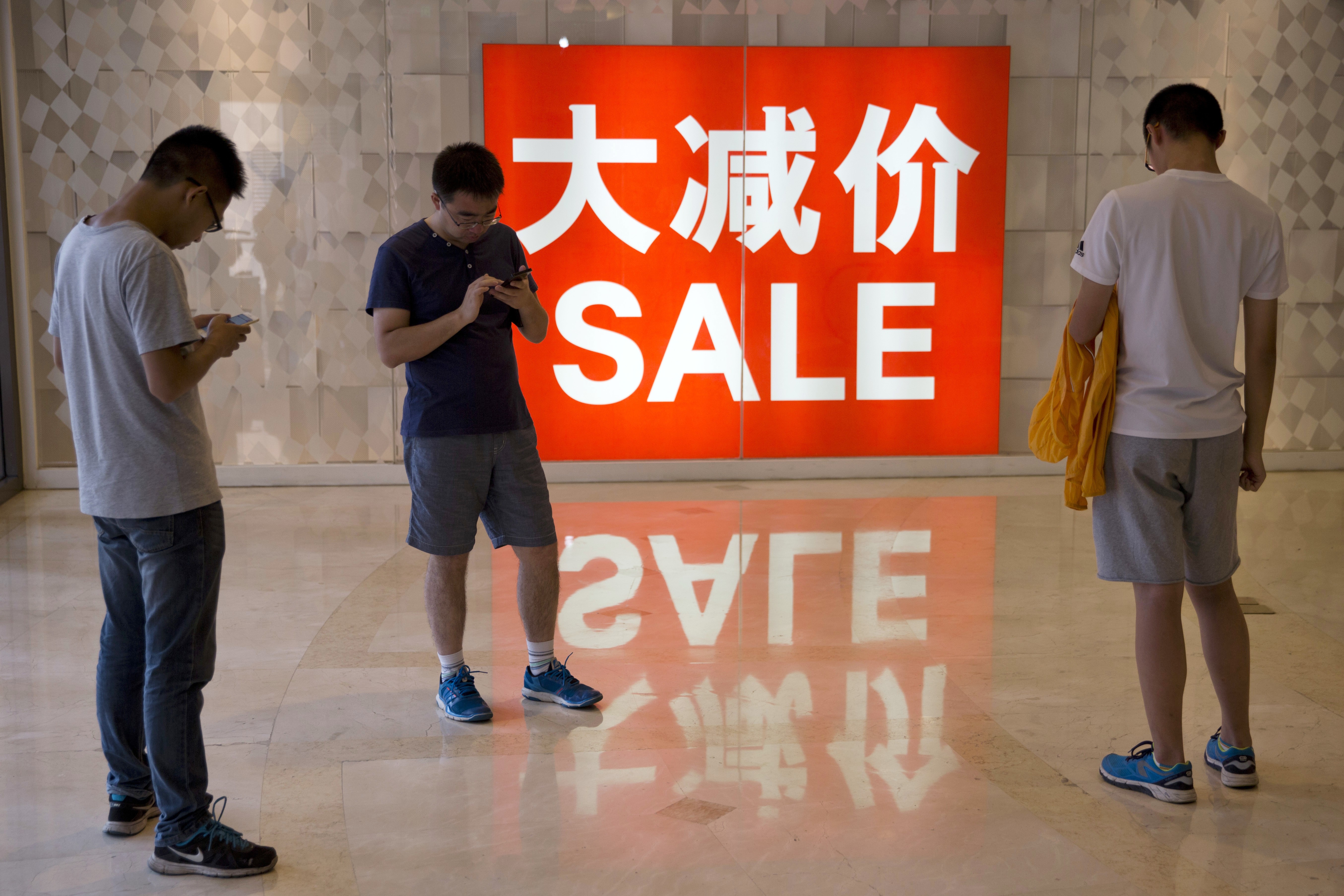 ‘Mass affluent’ consumers are generally young, tech-savvy, and more prone to free spending than their western counterparts, according to Oliver Wyman. Photo: AP