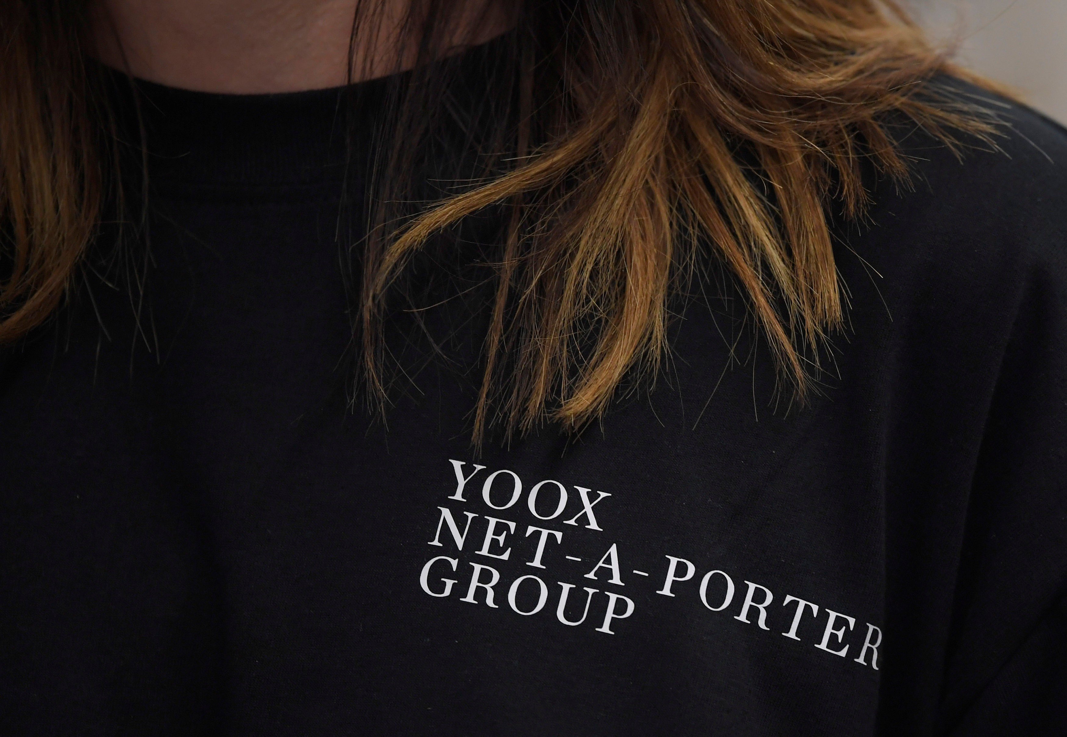 An employee of online clothing retailer Yoox Net-A-Porter, at its Tech Hub premises in White City in London. Shares in the company has risen on a report that Chinese e-commerce giant, Alibaba Group was interested in buying the company. .But a source at the company who did not want to be named has now told South China Morning Post the report “is not true”. Photo: Reuters